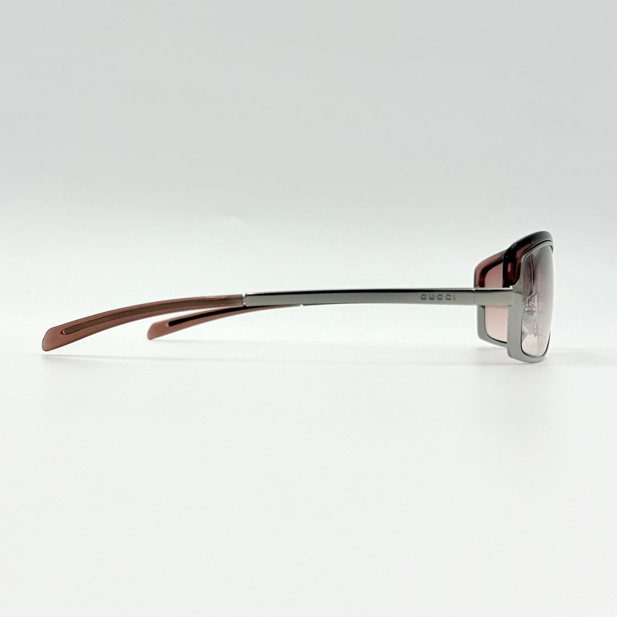 Gucci GG2689/S rectangle sunglasses in silver with pink gradient lenses, shown with case and cloth.