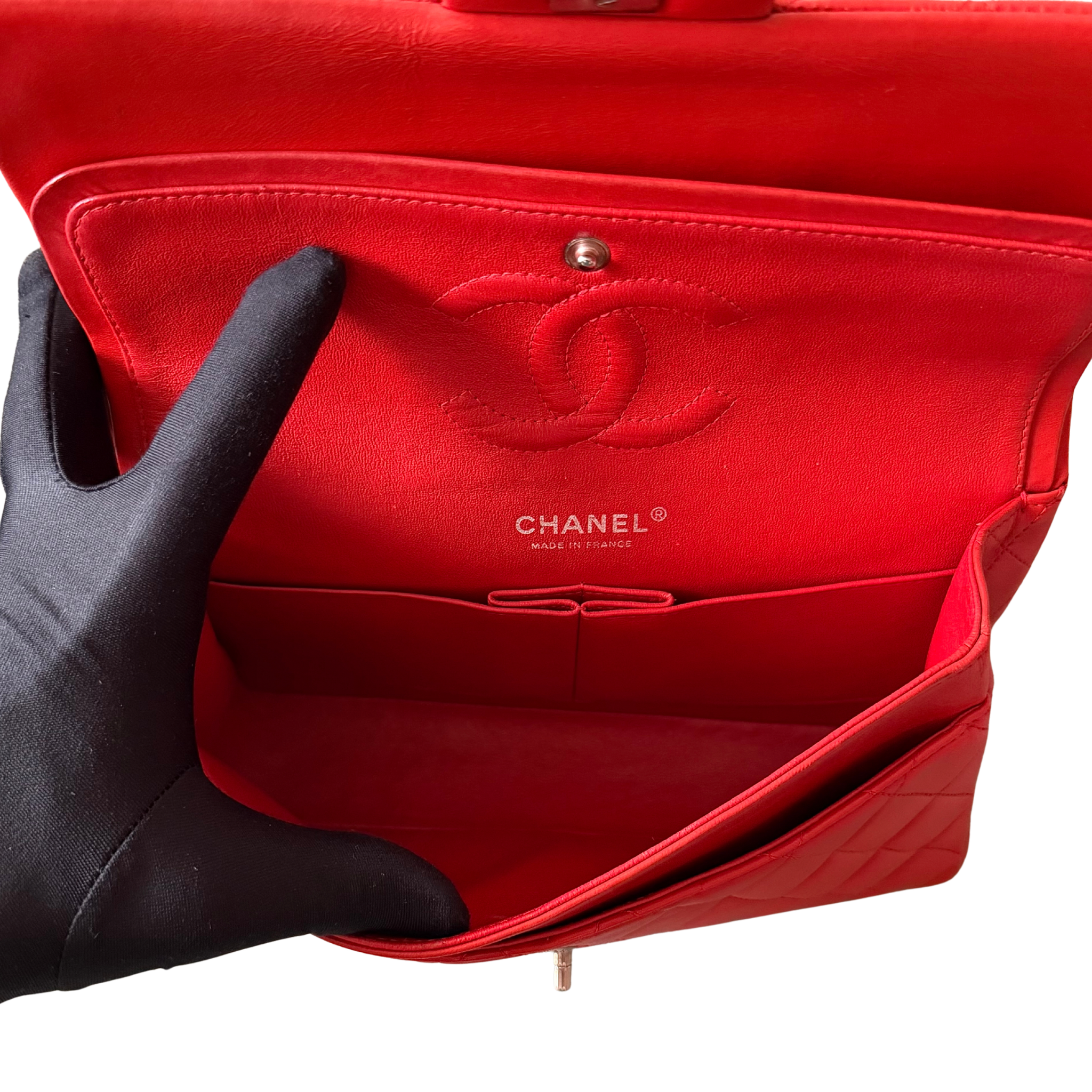 Chanel double flap shoulder bag in quilted red leather with silver-tone hardware and chain leather strap.