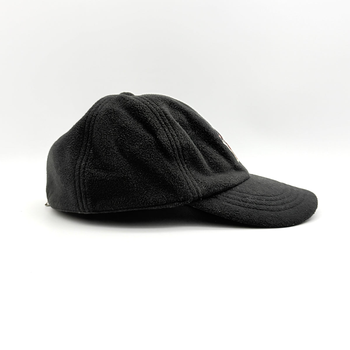 Moncler Grenoble black fleece baseball cap with tri-colour logo patch on the front and tonal embroidery details.