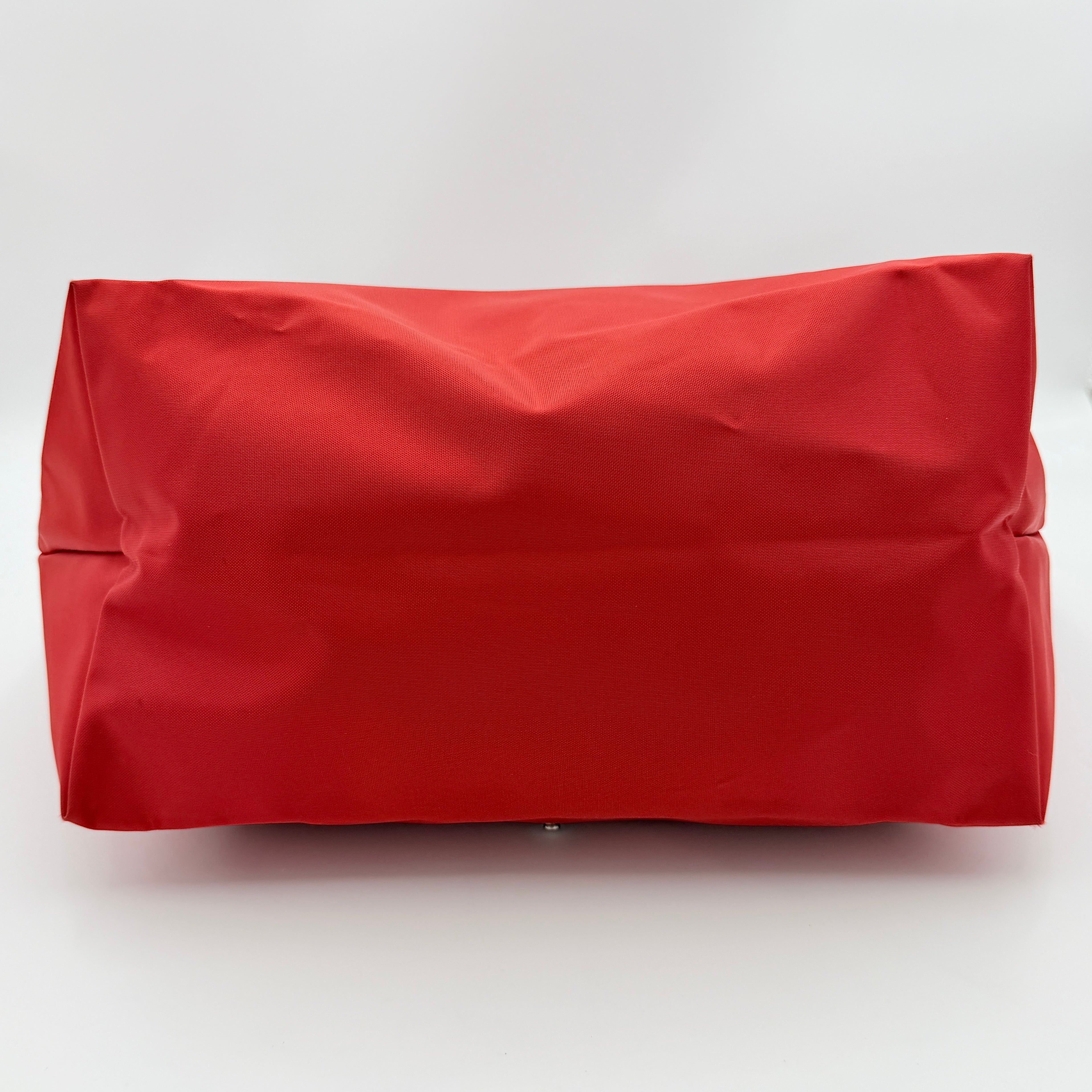 Longchamp Le Pliage Club tote bag in red nylon with tonal leather accents and silver hardware.