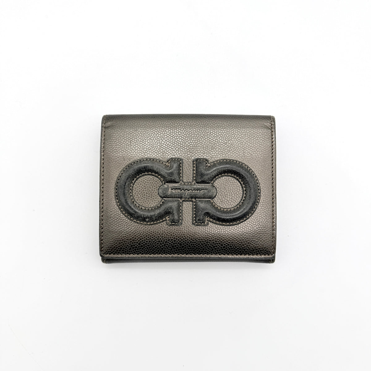 Salvatore Ferragamo Gancini Embossed Bifold Wallet in metallic grey textured leather, front view.