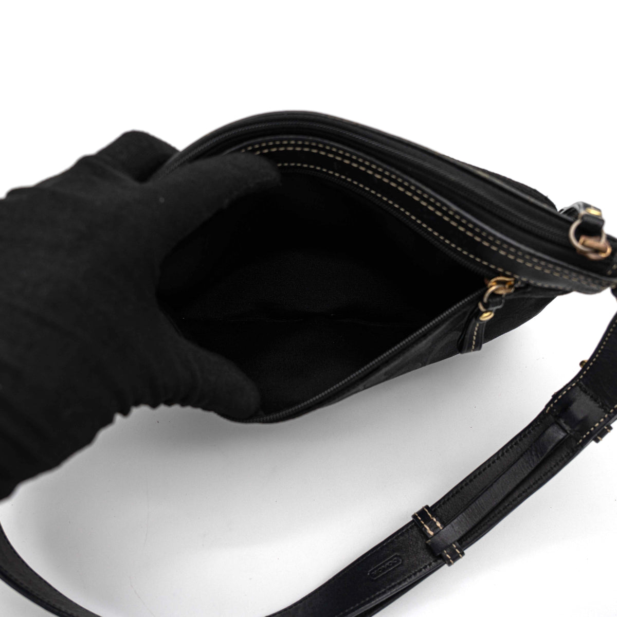 Coach Signature Double Pocket Shoulder Bag in black jacquard with dual zip pockets and an adjustable leather strap.