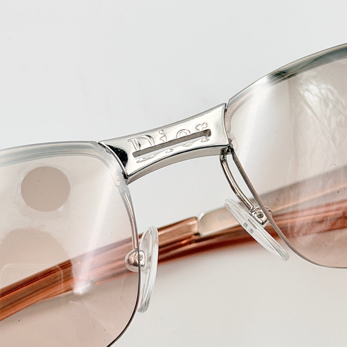 Dior Adiorable 3/L rimless sunglasses with rose pink gradient lenses and silver frame, presented with Dior hard case.
