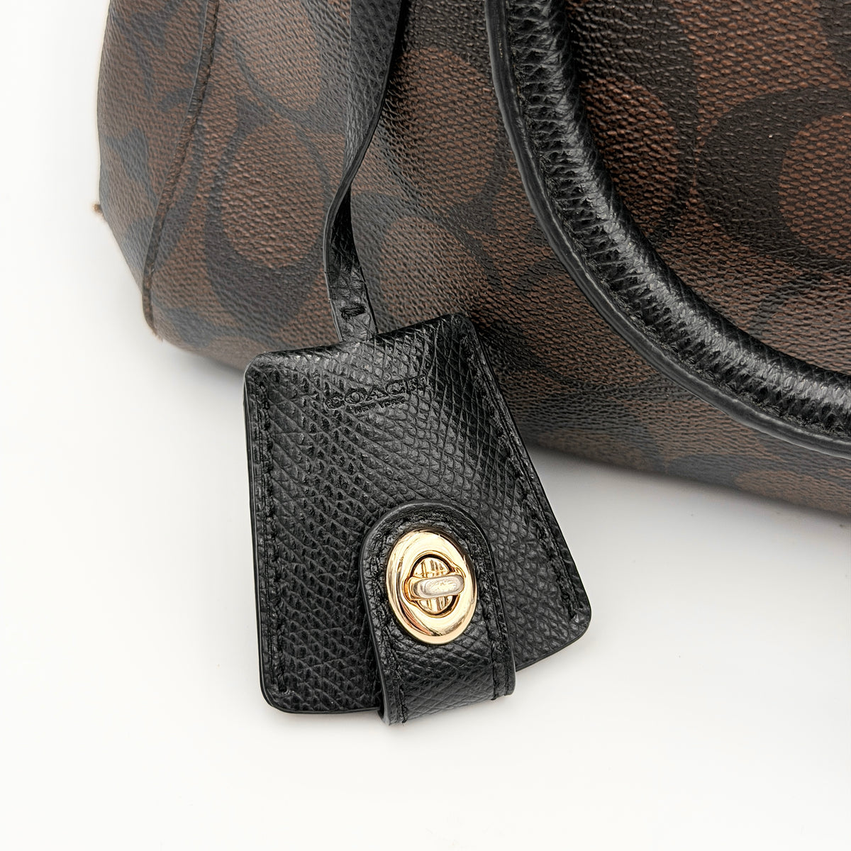 Coach 2Way Signature Margot Carryall Satchel in brown with black leather handles and gold hardware, shown with detachable strap.