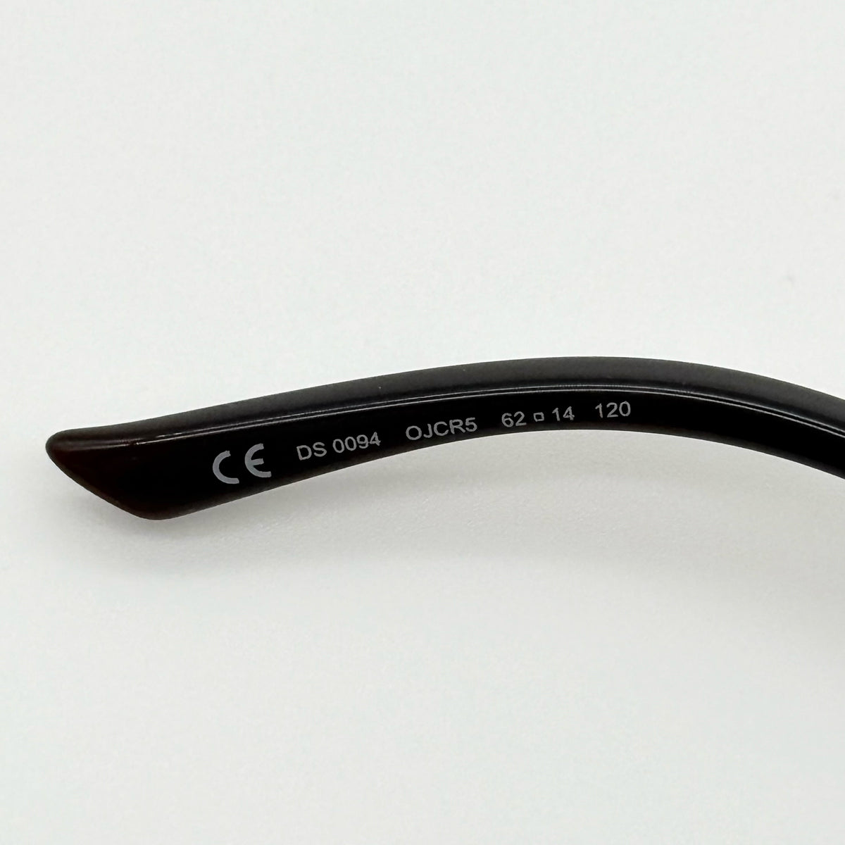 Diesel DS0094 sunglasses in gradient brown with oversized round lenses, shown with branded case and cleaning cloth.