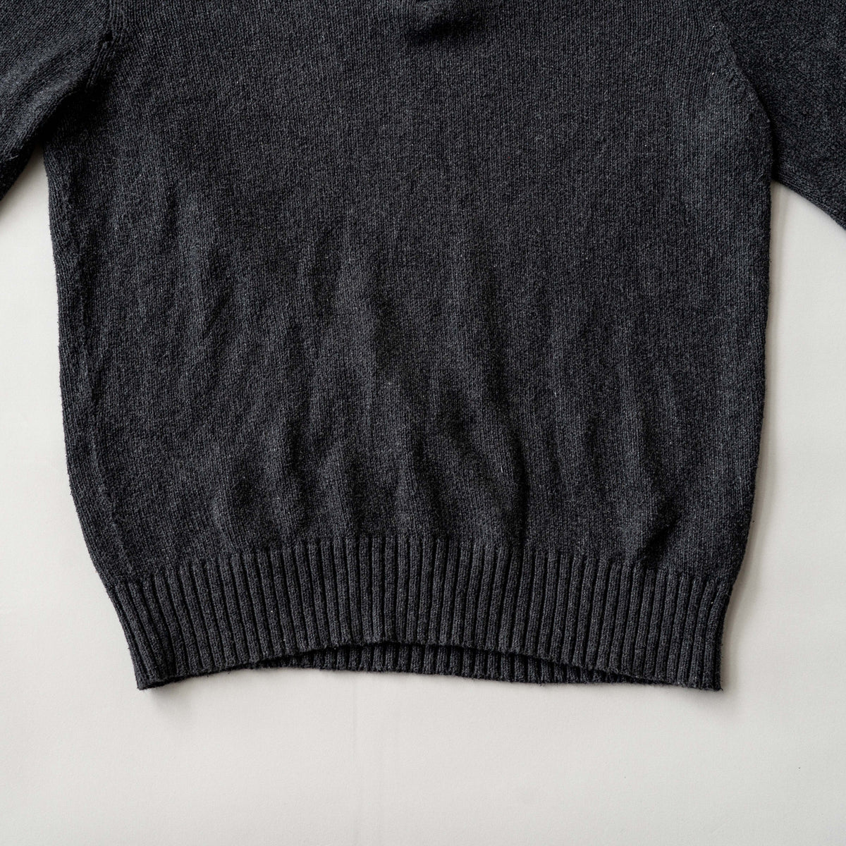 Dark grey Polo Ralph Lauren quarter zip mockneck pullover sweater with ribbed collar and green pony logo.