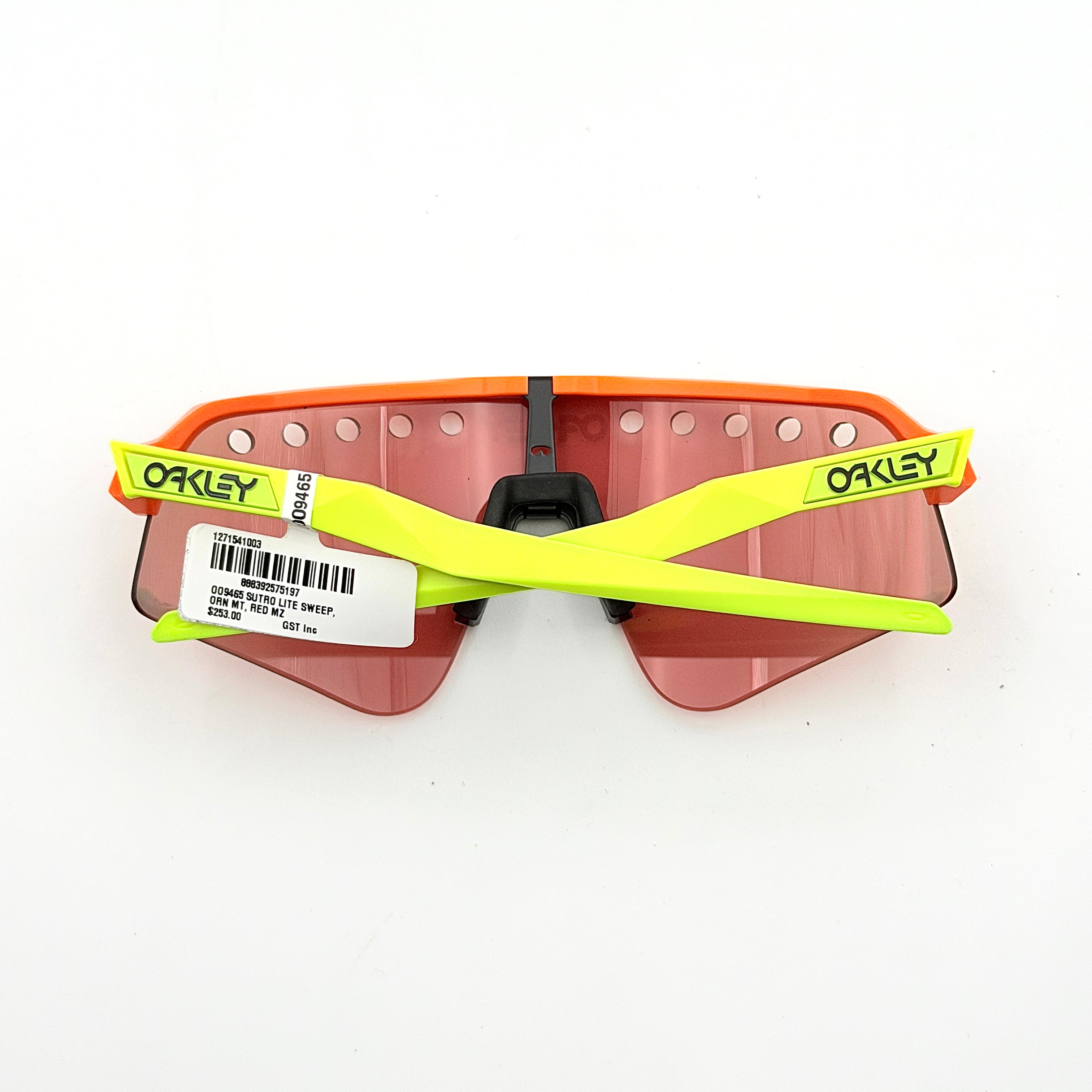 Oakley Sutro Lite Sweep sunglasses in neon yellow and orange with Prizm Trail Torch shield lens, displayed with box and case.