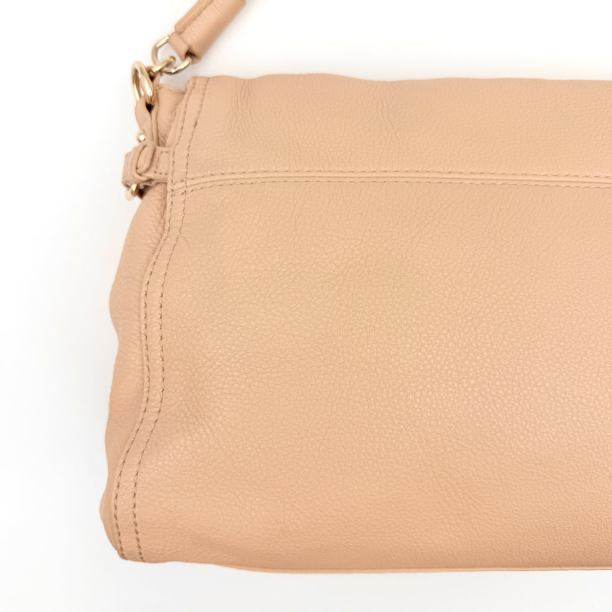 Kate Spade Cobble Hill Little Minka in beige pebbled leather with both top handle and detachable strap displayed.