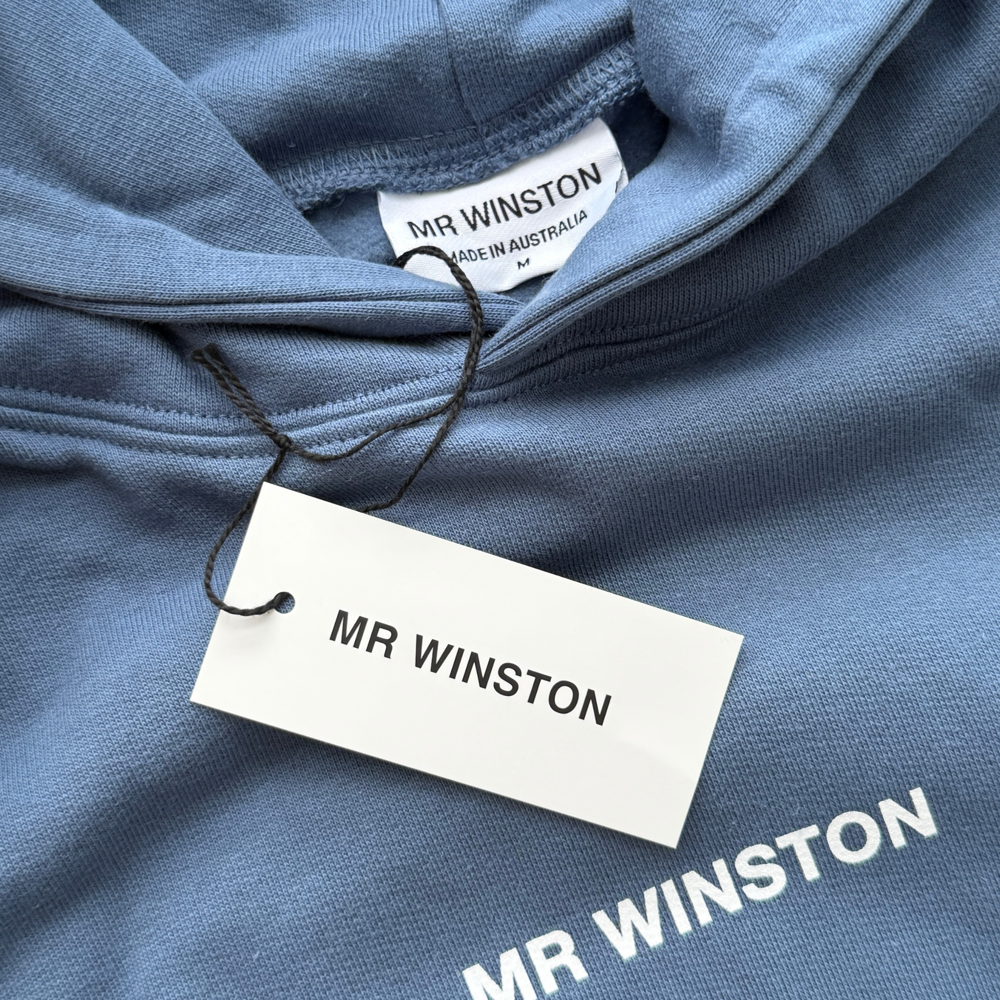 Mr Winston navy hooded sweatshirt with front logo detail, shown laid flat.