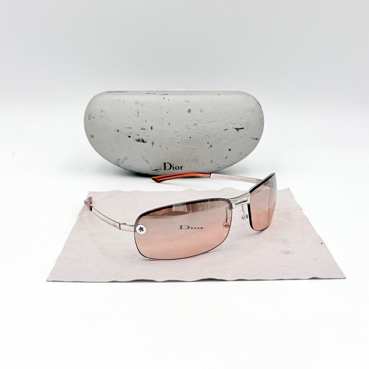 Dior Adiorable 3/L rimless sunglasses with rose pink gradient lenses and silver frame, presented with Dior hard case.