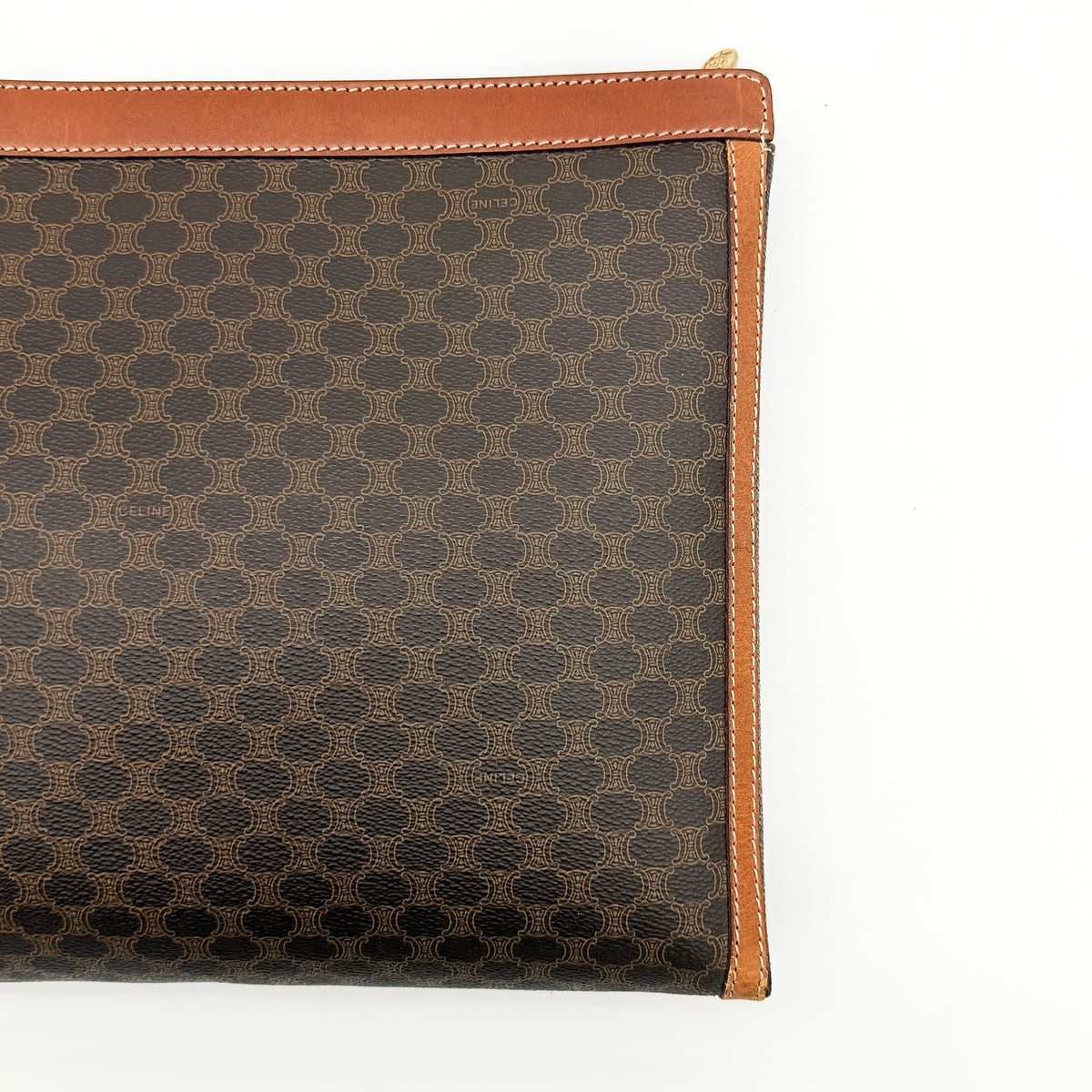 Celine Triomphe Macadam Clutch Bag in brown coated canvas with leather trim, shown against a white background.