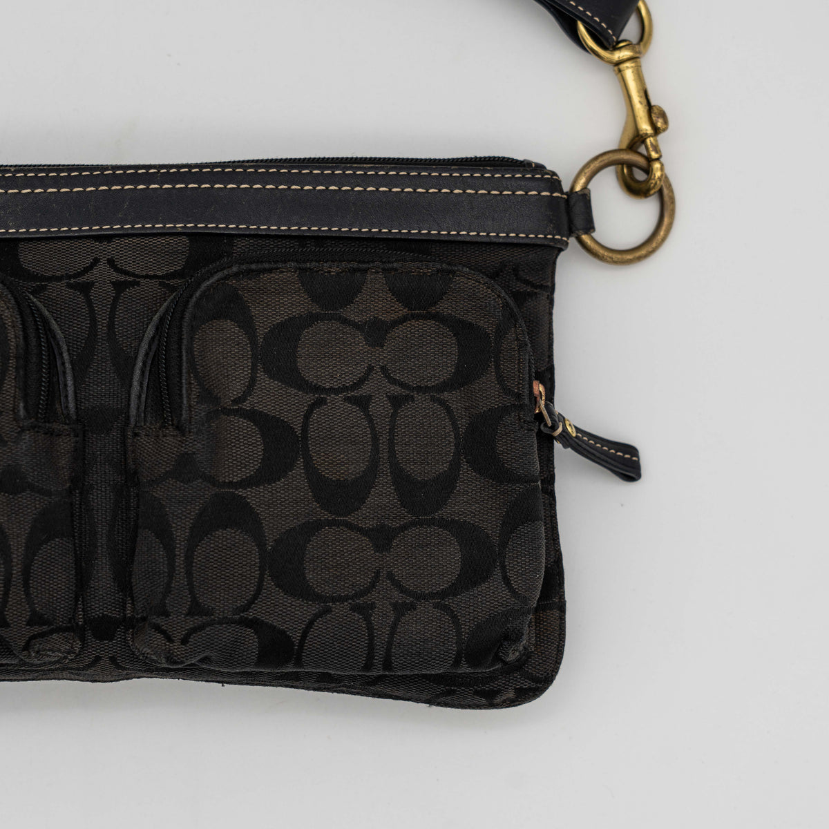 Coach Signature Double Pocket Shoulder Bag in black jacquard with dual zip pockets and an adjustable leather strap.