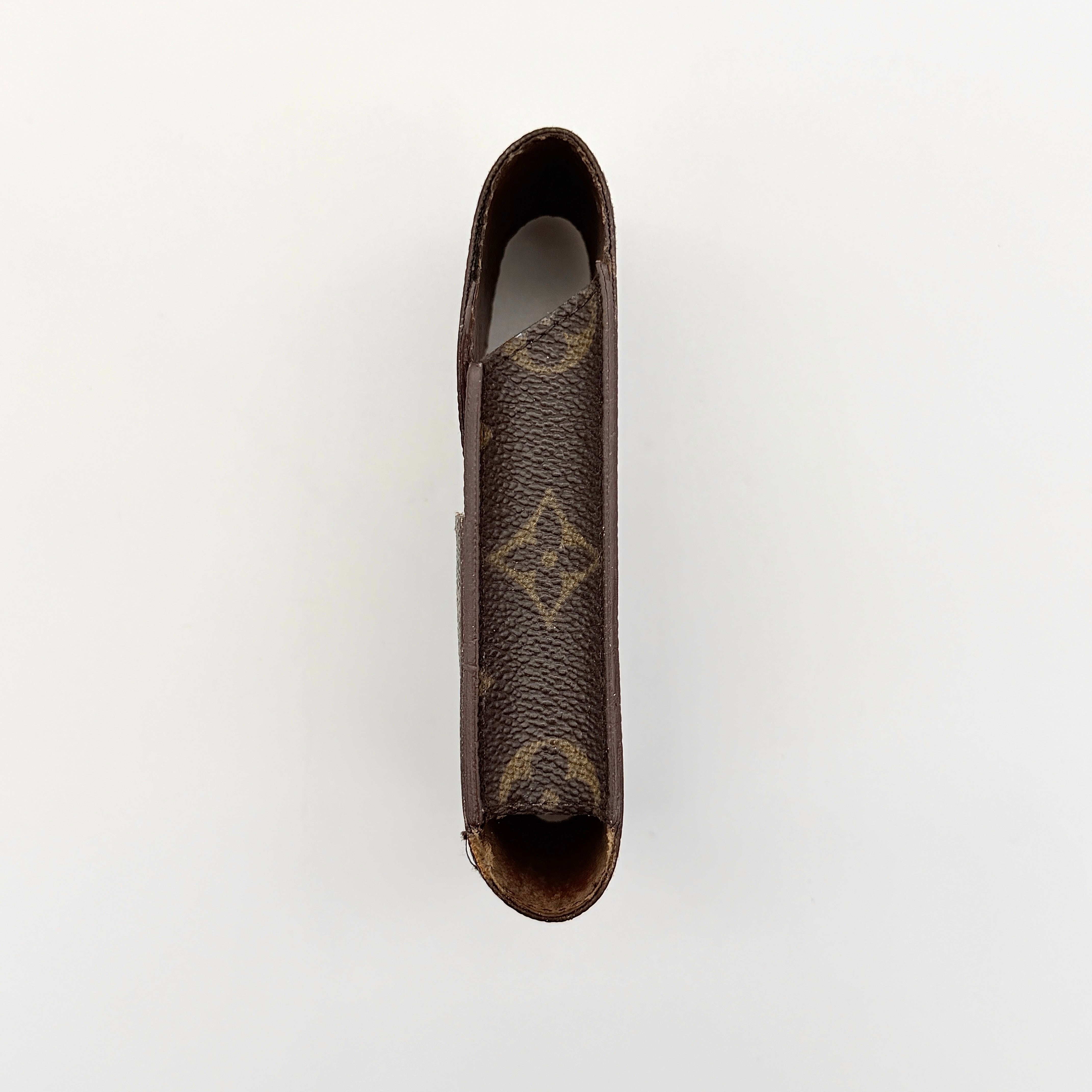 Louis Vuitton Monogram cigarette case in brown coated canvas with flap top, shown from the front.