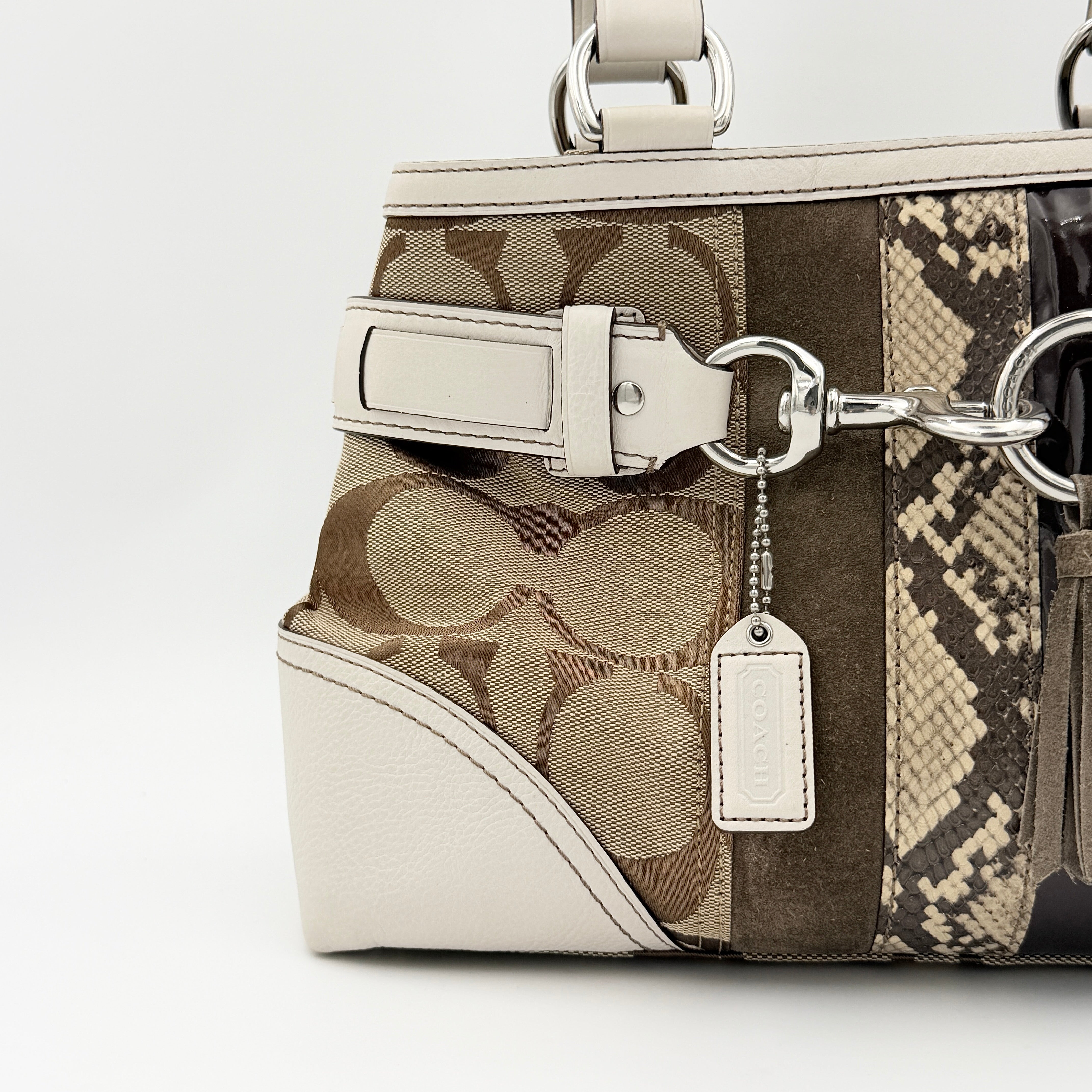 Coach Signature Hampton Python Stripe Handbag in multicolour leather and canvas with silver-tone hardware and an orange scarf detail.