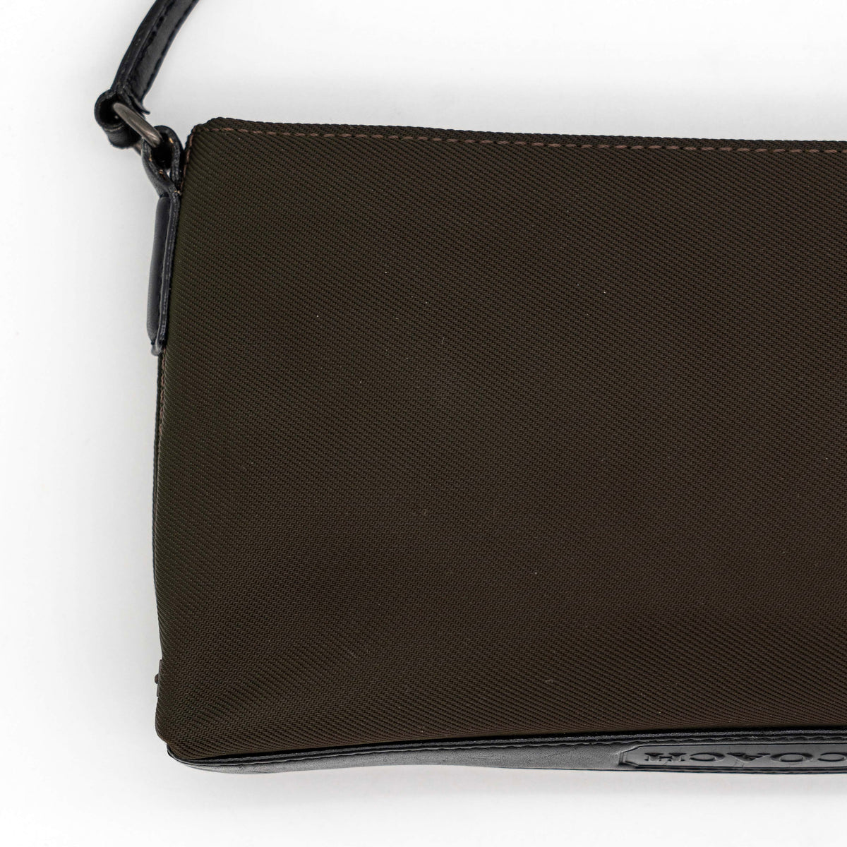 Coach Mercer Demi Tote Bag in brown nylon with black leather trim and gunmetal hardware, shown with signature Coach tag.