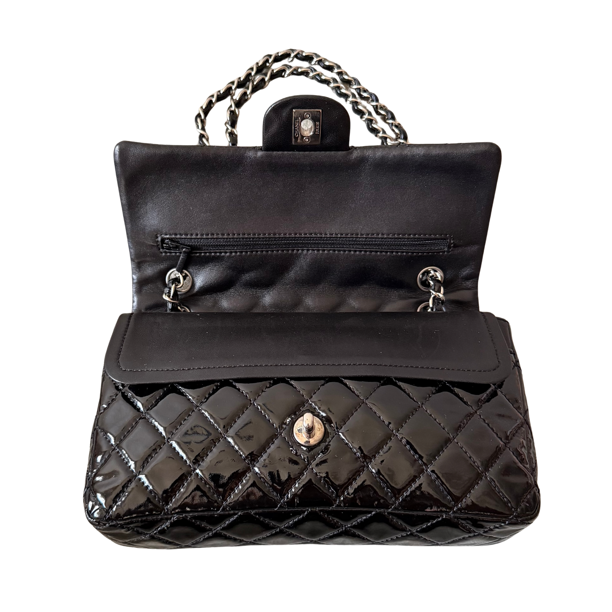 Chanel 25 Matelasse Double Flap bag in glossy black patent leather with silver-tone hardware and quilted finish.