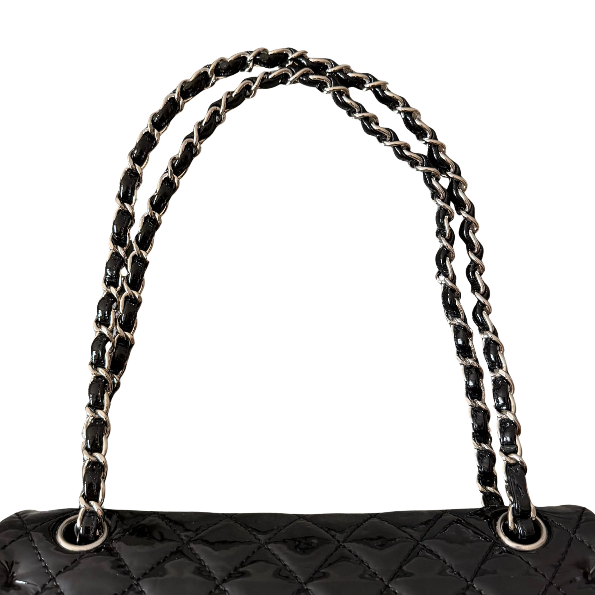 Chanel 25 Matelasse Double Flap bag in glossy black patent leather with silver-tone hardware and quilted finish.