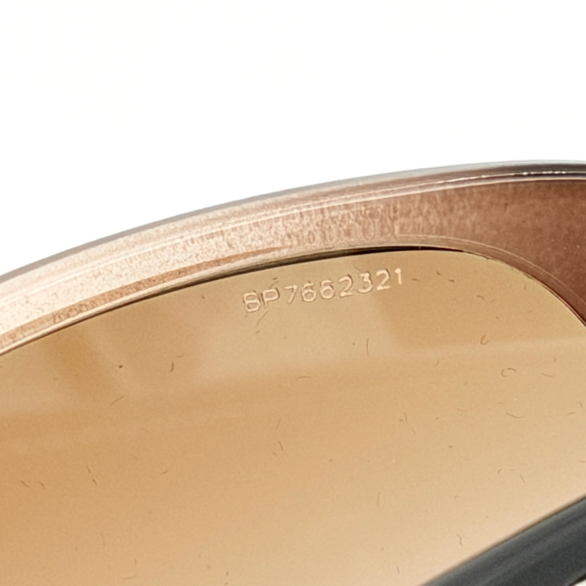 Prada SPR080 sunglasses featuring a brown and blush oversized frame with gradient lenses and silver hardware at the temples.