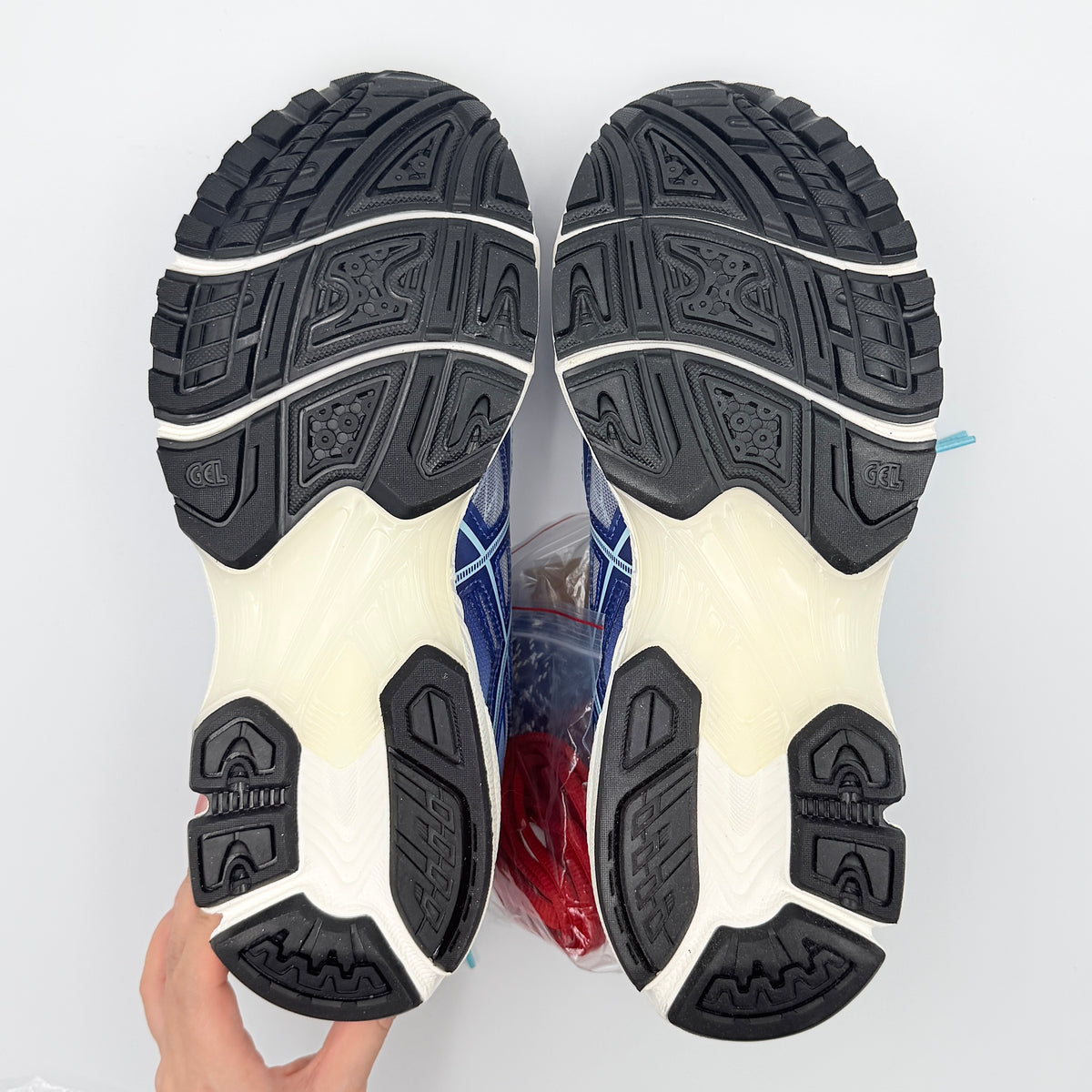 ASICS x KITH Gel-Nimbus 10.1 Mega Man sneakers in bold blue and silver, displayed with extra laces and distinctive collaboration details.