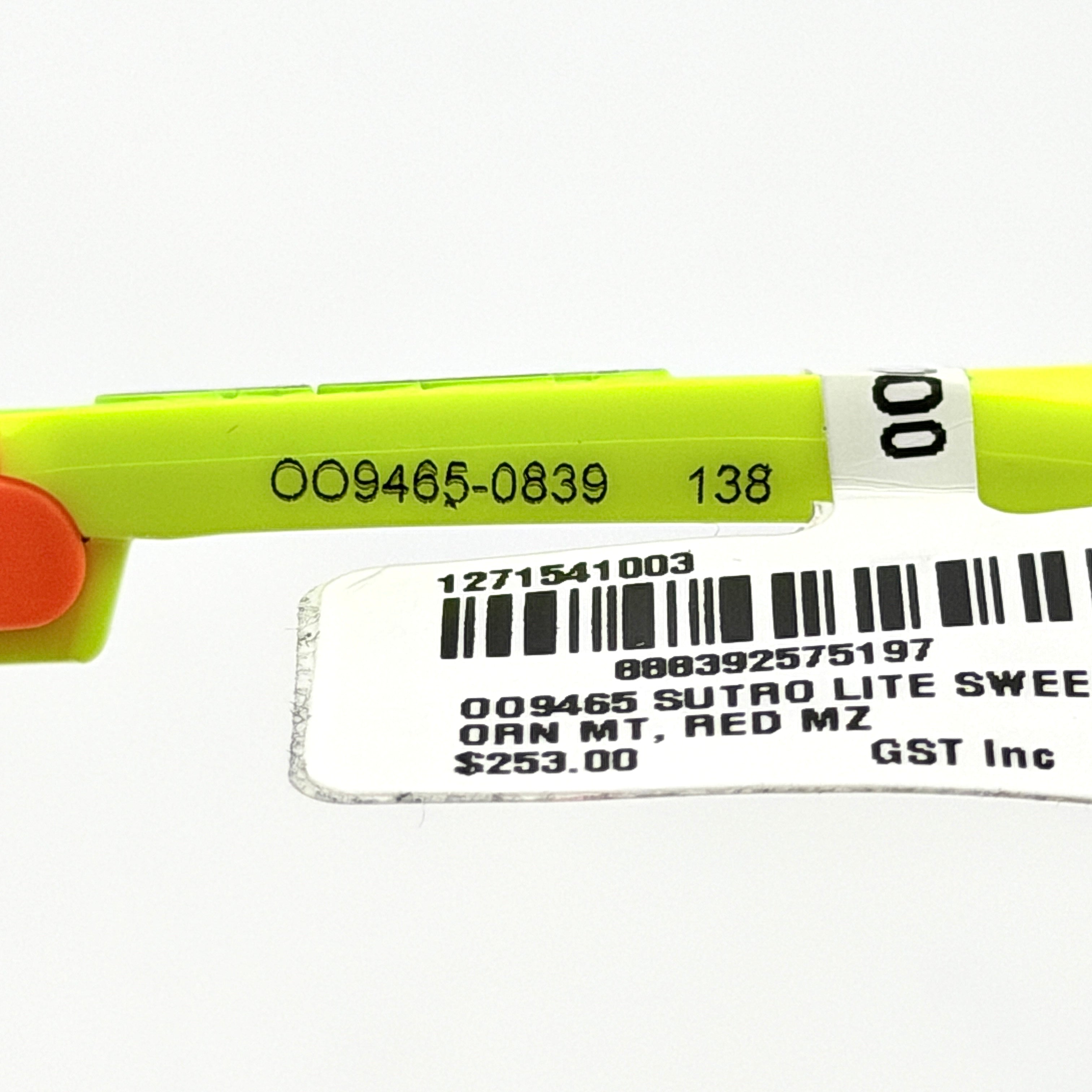 Oakley Sutro Lite Sweep sunglasses in neon yellow and orange with Prizm Trail Torch shield lens, displayed with box and case.