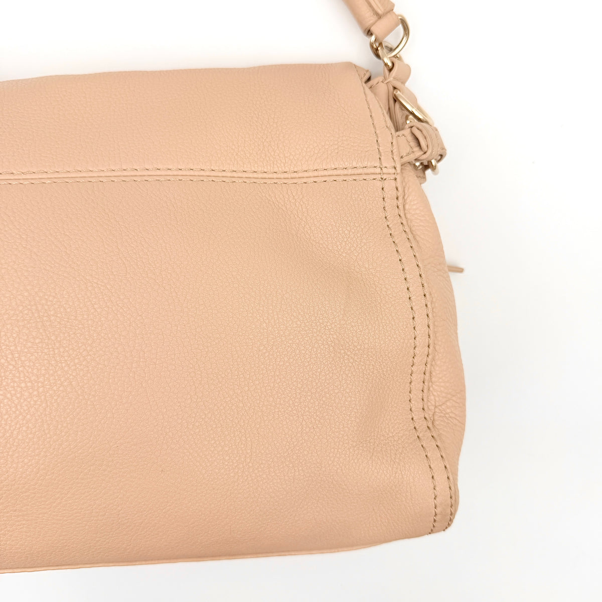Kate Spade Cobble Hill Little Minka in beige pebbled leather with both top handle and detachable strap displayed.