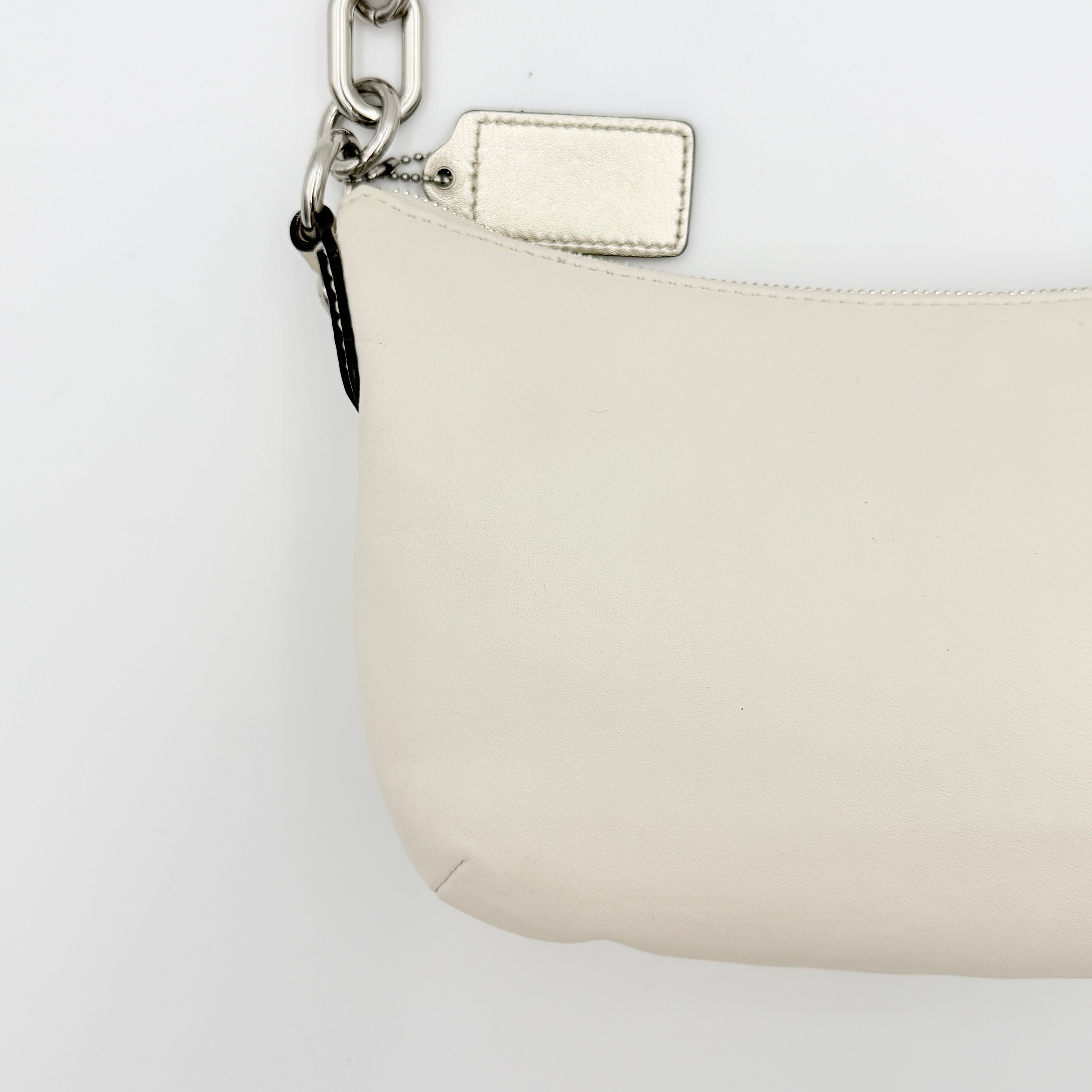 Coach Kristin Hobo Shoulder Bag in ivory leather with silver-tone hardware and a structured short strap.
