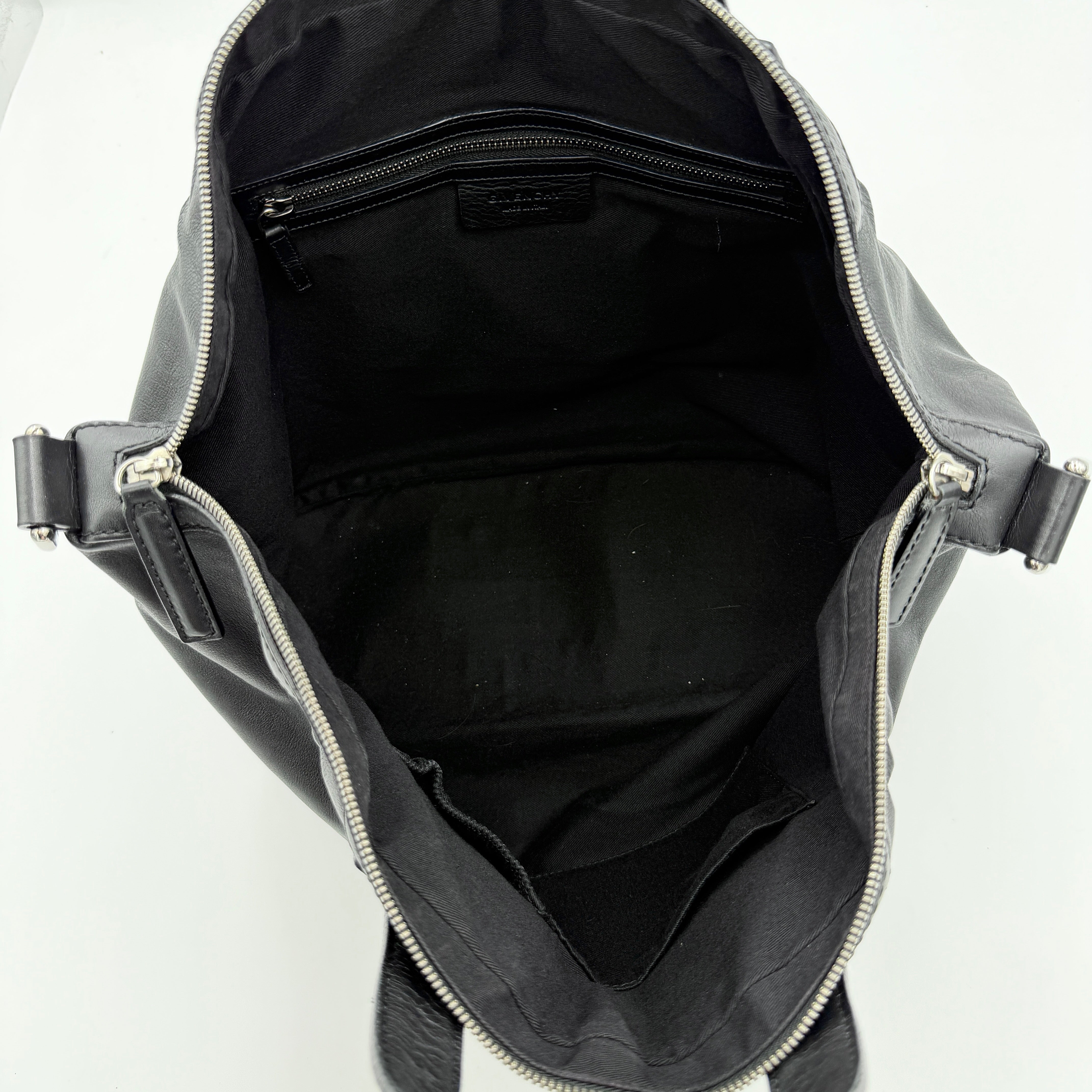 Givenchy 2Way Nightingale Handbag in black leather with detachable strap and striking front motif.