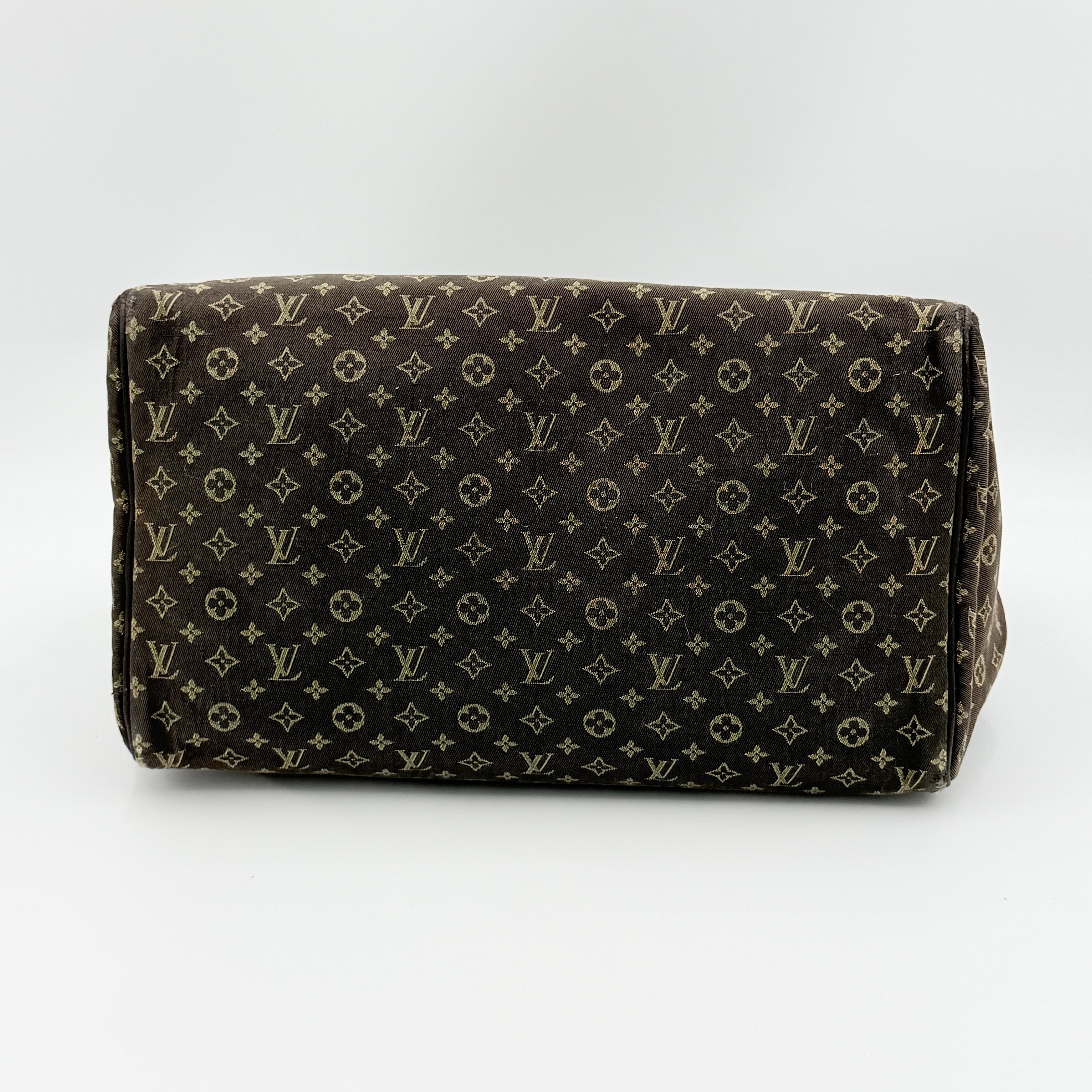 Louis Vuitton Monogram Mini Lin Speedy 30 in brown textile with top handles and monogram motif, shown against a white background.