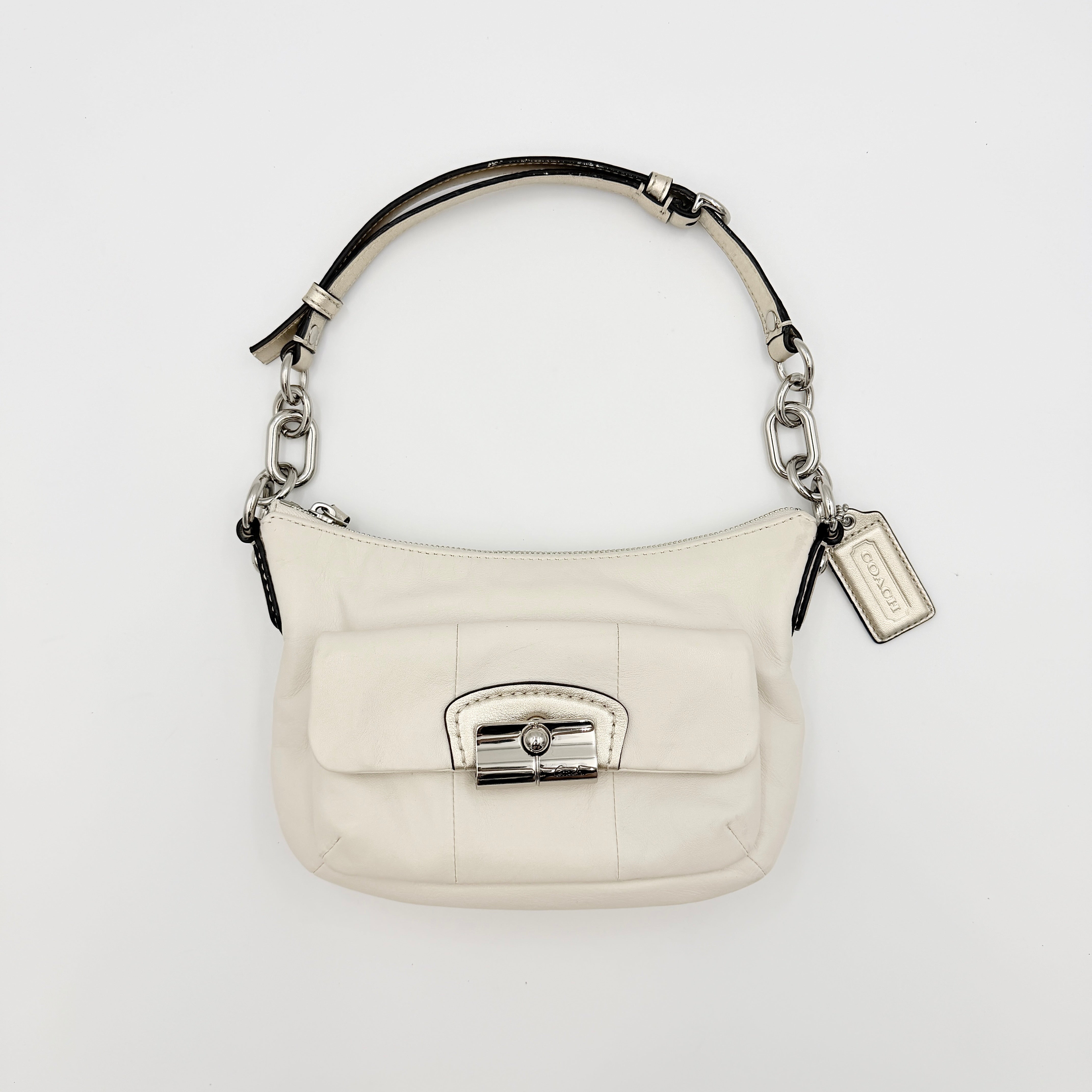 Coach Kristin Hobo Shoulder Bag in ivory leather with silver-tone hardware and a structured short strap.