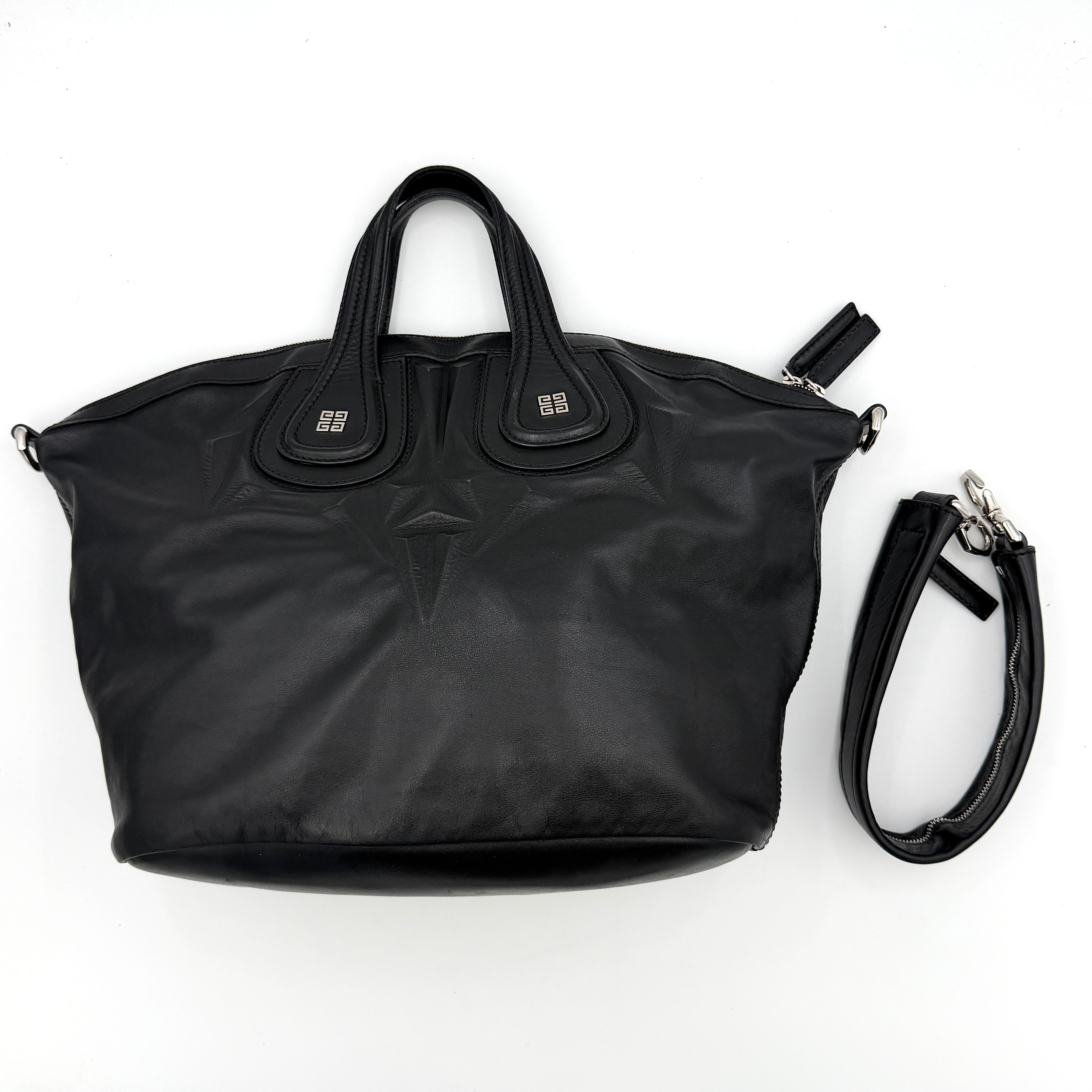 Givenchy 2Way Nightingale Handbag in black leather with detachable strap and striking front motif.