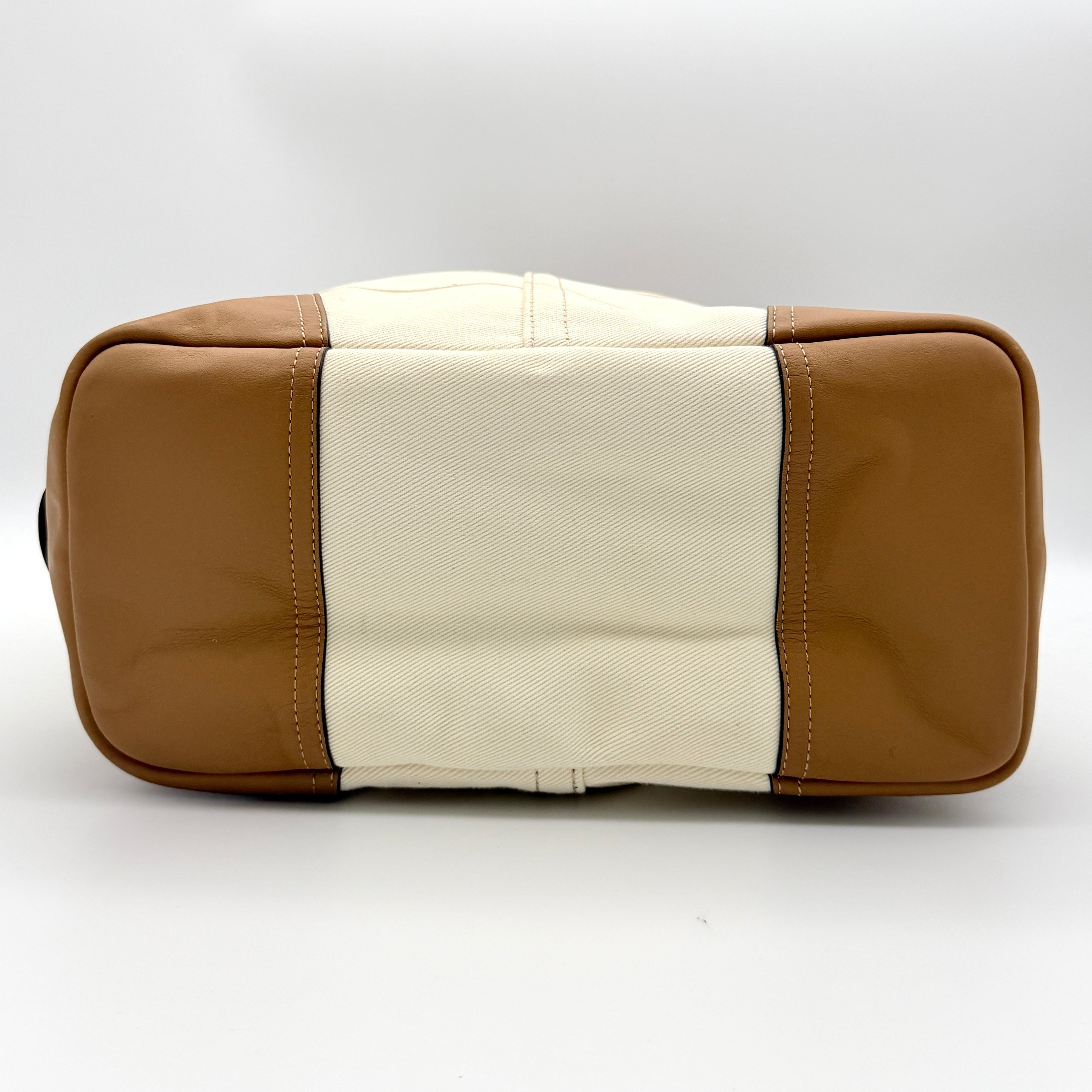 Coach Hadley Variegated Stripe Handbag in beige and tan canvas with leather trim, shown with top handles and detachable strap.