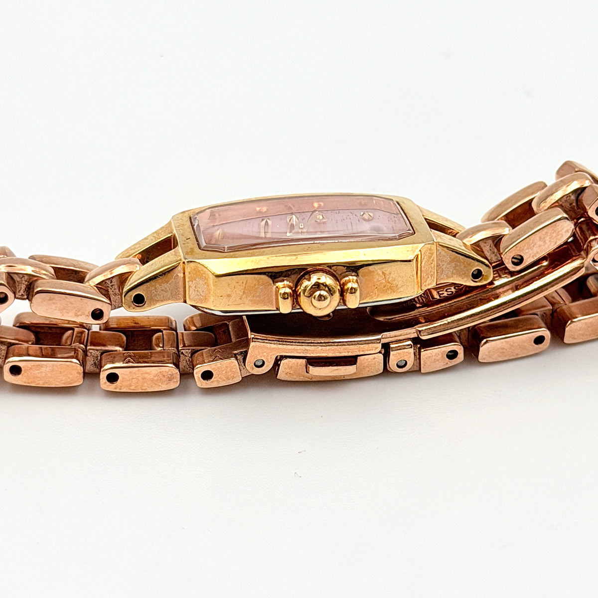 Front view of the Seiko Tisse Nozomi Special Edition watch with a pink heart motif dial and two-tone gold and rose gold bracelet.