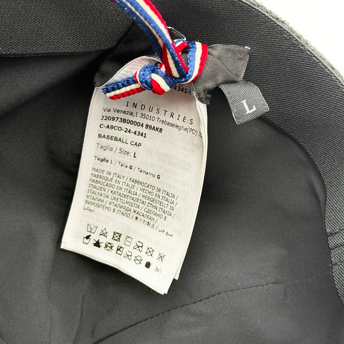 Moncler Grenoble black fleece baseball cap with tri-colour logo patch on the front and tonal embroidery details.