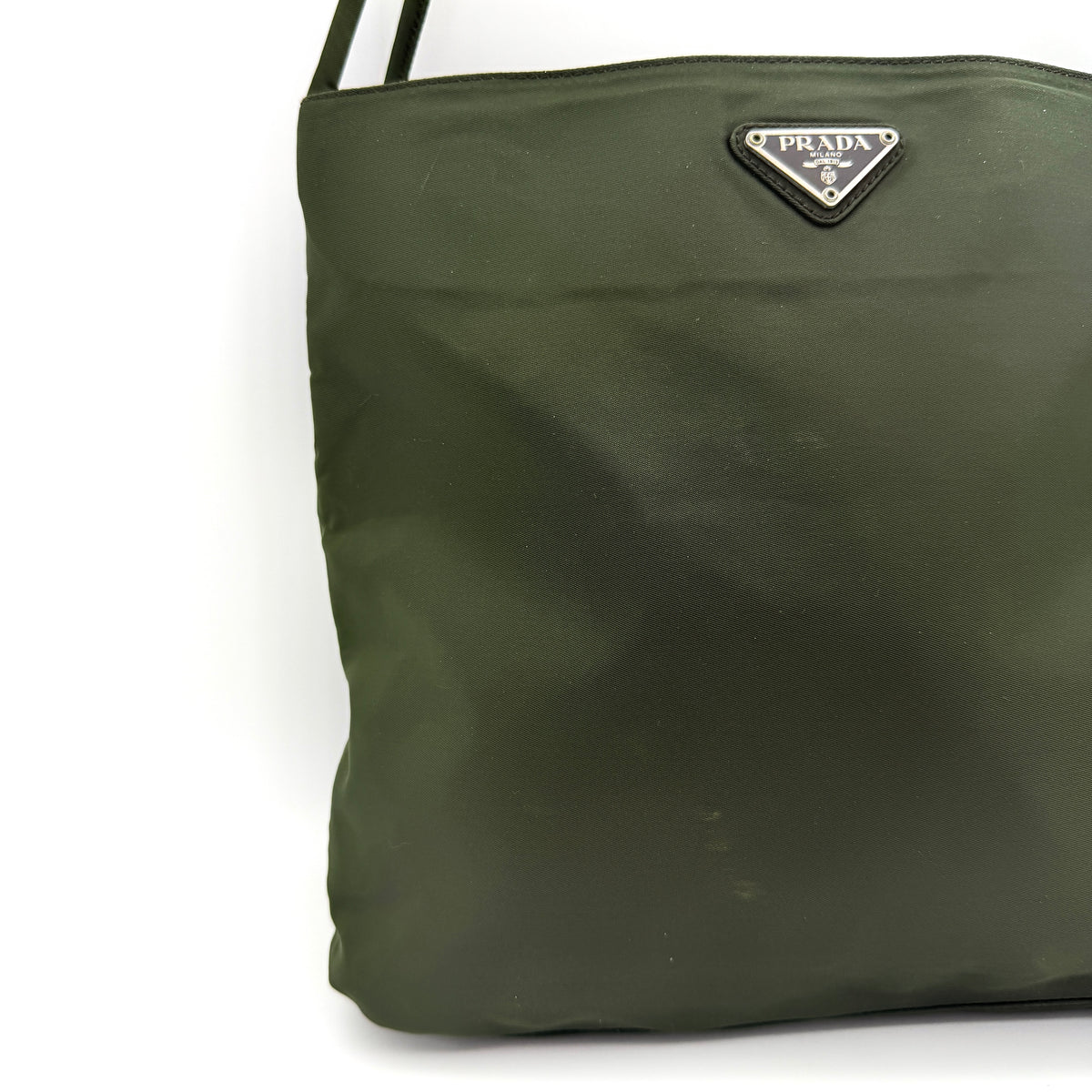 Prada Tessuto Nylon City Tote Bag in dark green nylon with double handles and signature triangle logo plaque on the front.