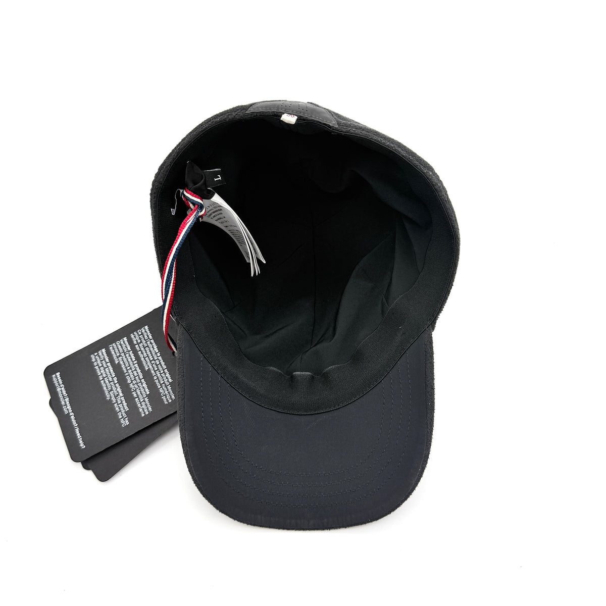 Moncler Grenoble black fleece baseball cap with tri-colour logo patch on the front and tonal embroidery details.