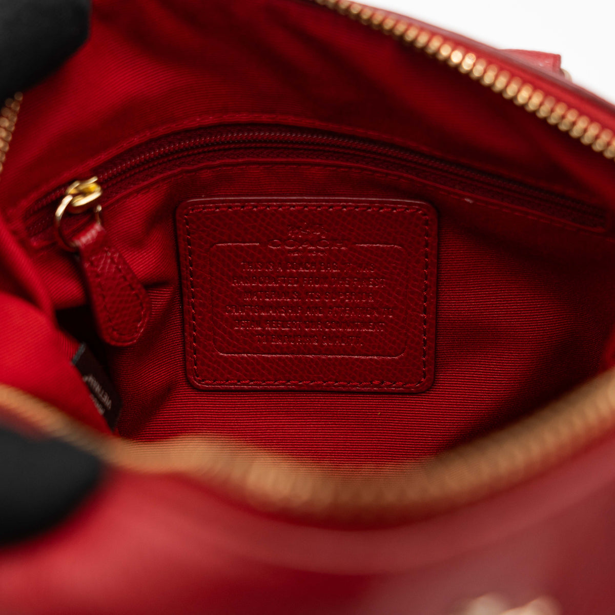 Coach Mini Bennett Boston bag in signature beige canvas with red leather trim, shown with detachable crossbody strap.