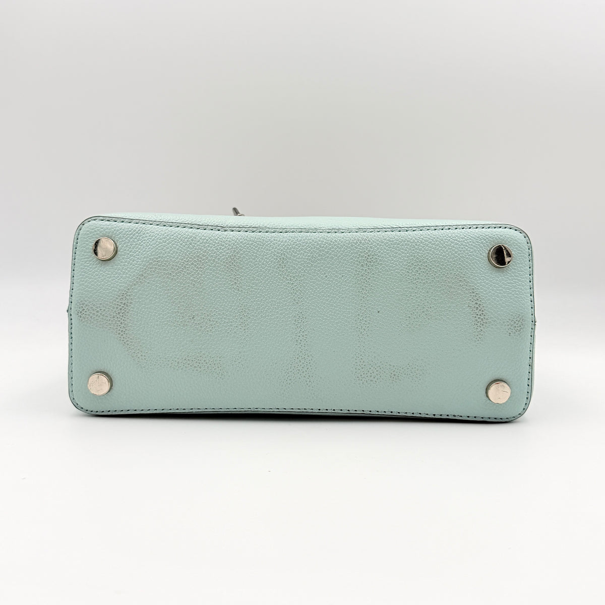 Kate Spade New York Margaux satchel in mint green pebbled leather with taupe handles, shown with its detachable strap and a clear pouch.