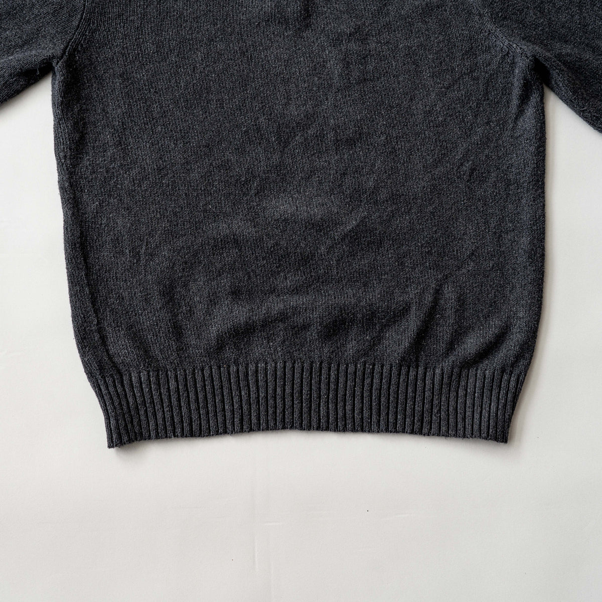 Dark grey Polo Ralph Lauren quarter zip mockneck pullover sweater with ribbed collar and green pony logo.