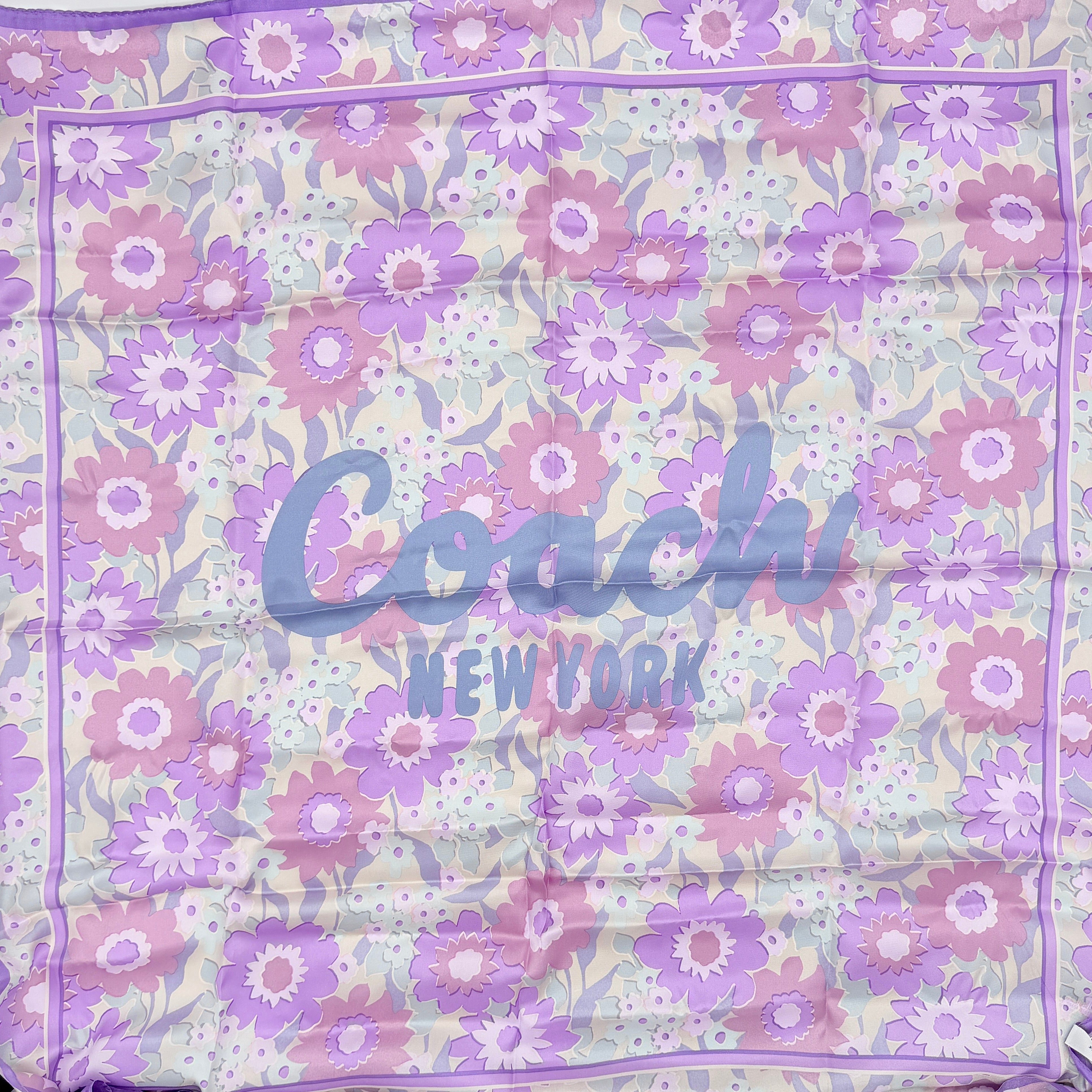 Coach floral silk scarf in purple with logo, presented with original packaging and tags.