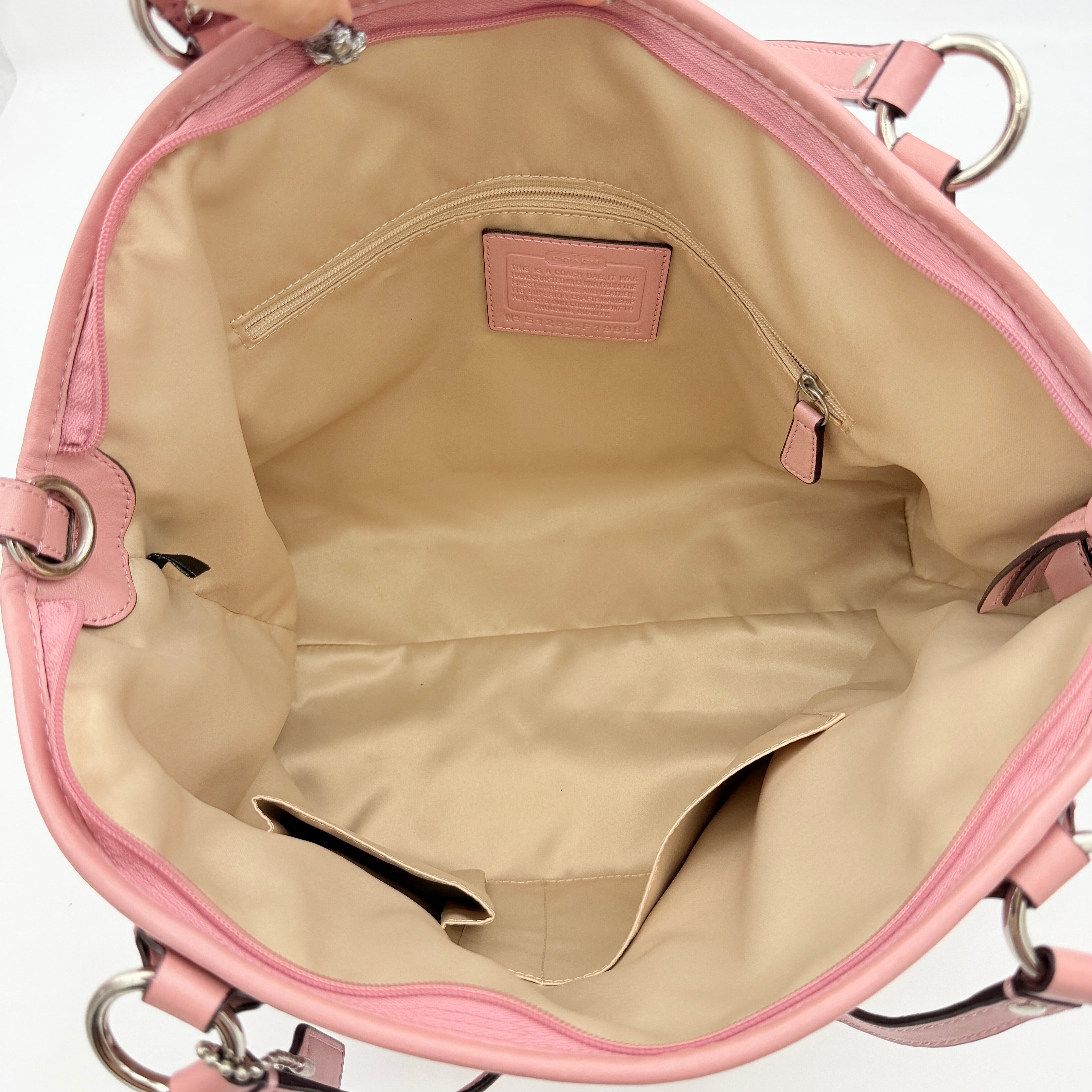 Coach 2Way Perforated Shoulder Bag in soft pink leather with silver hardware and detachable strap, displayed on a white background.