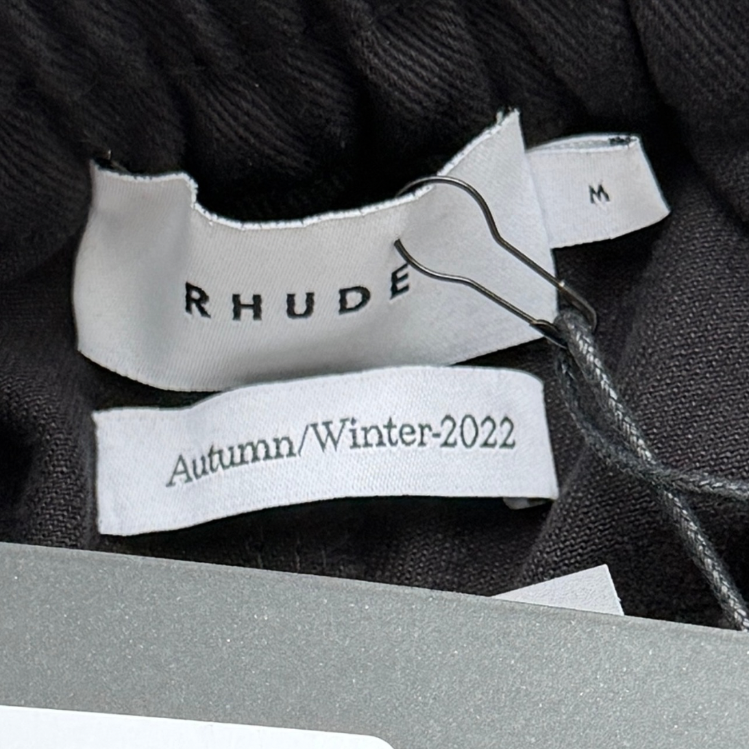 Rhude Piped Twill Pant in black cotton twill with ochre piping and a relaxed drawstring waist.