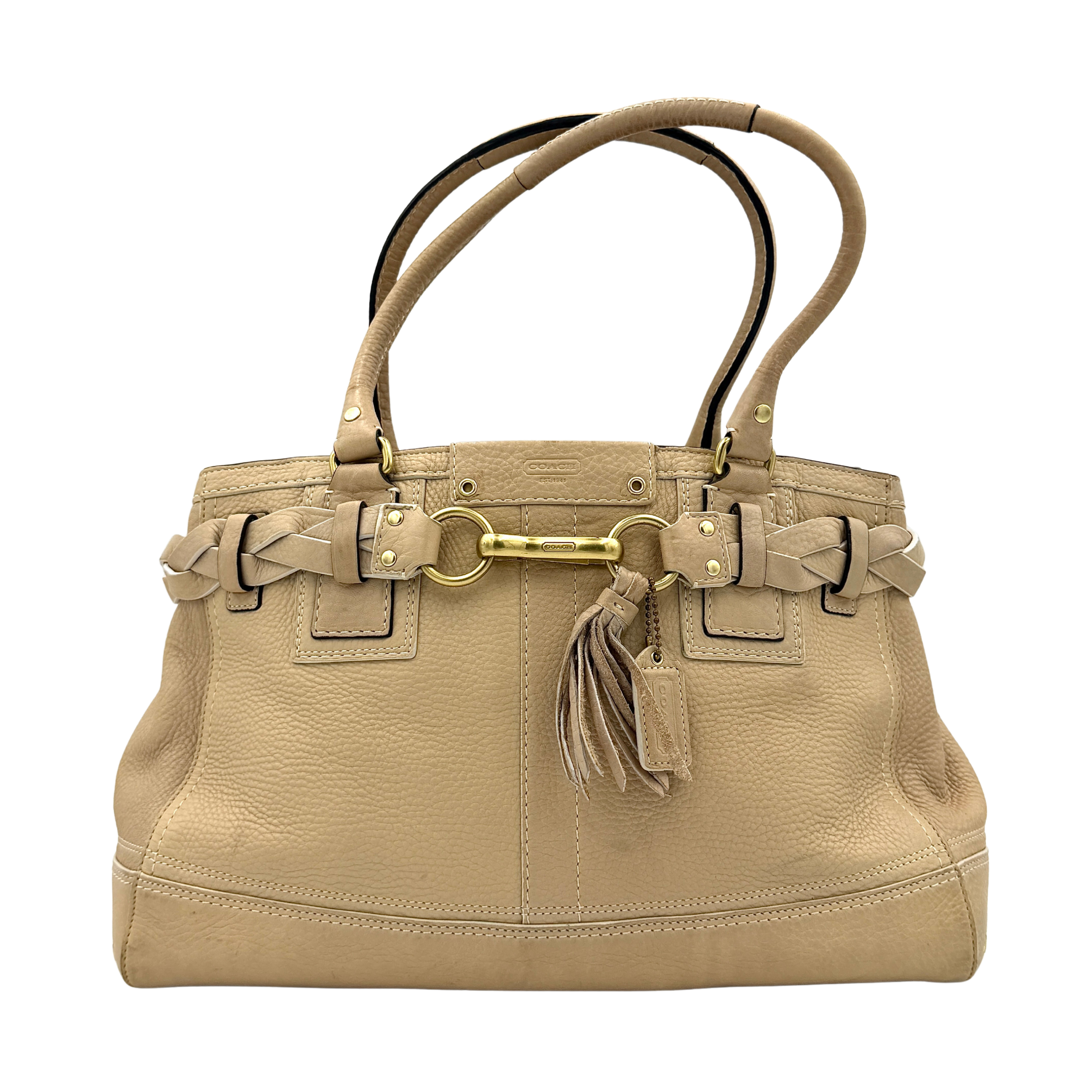 Coach beige Hampton Carryall Shoulder Bag with braided leather details, gold hardware, and tassel accent, displayed front-facing.