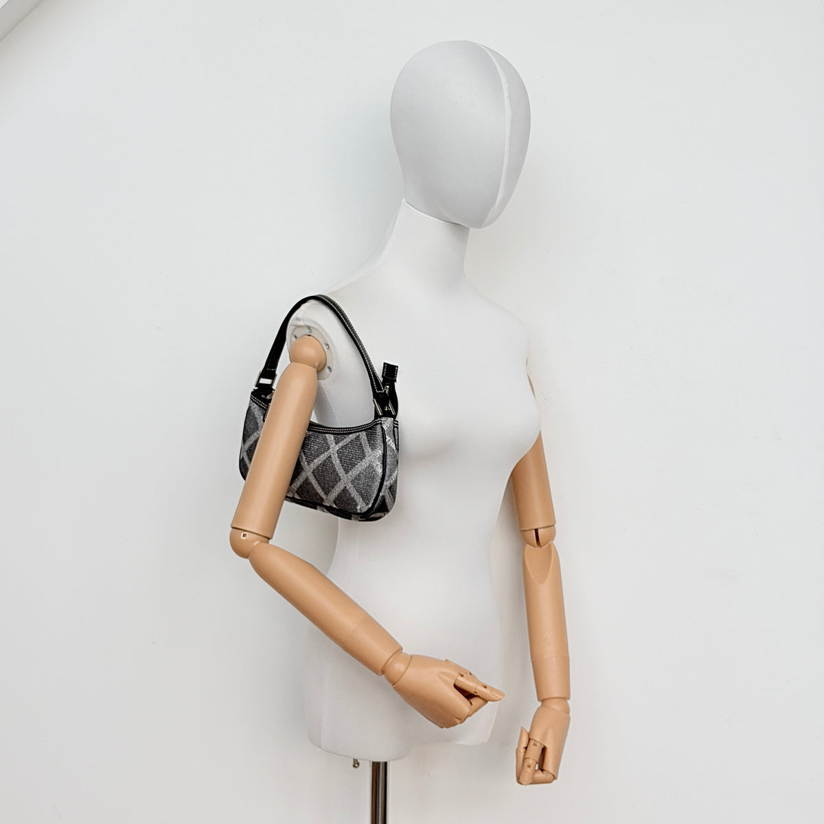 Samantha Thavasa Monogram Baguette Shoulder Bag in grey and black with all-over logo print and black strap.