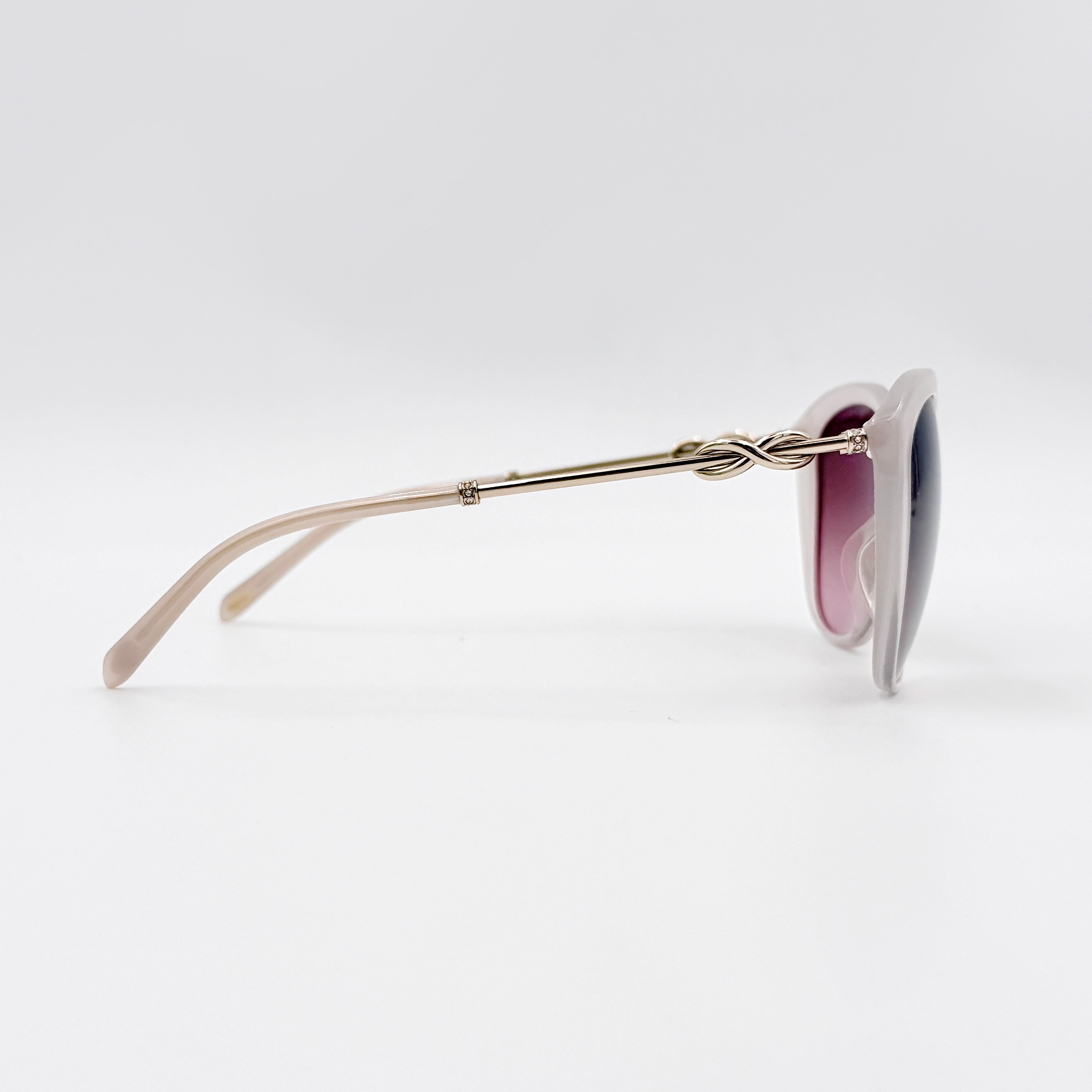 Tiffany & Co. TF4144 sunglasses in pink with gold-tone knot detail arms, shown with signature blue case.