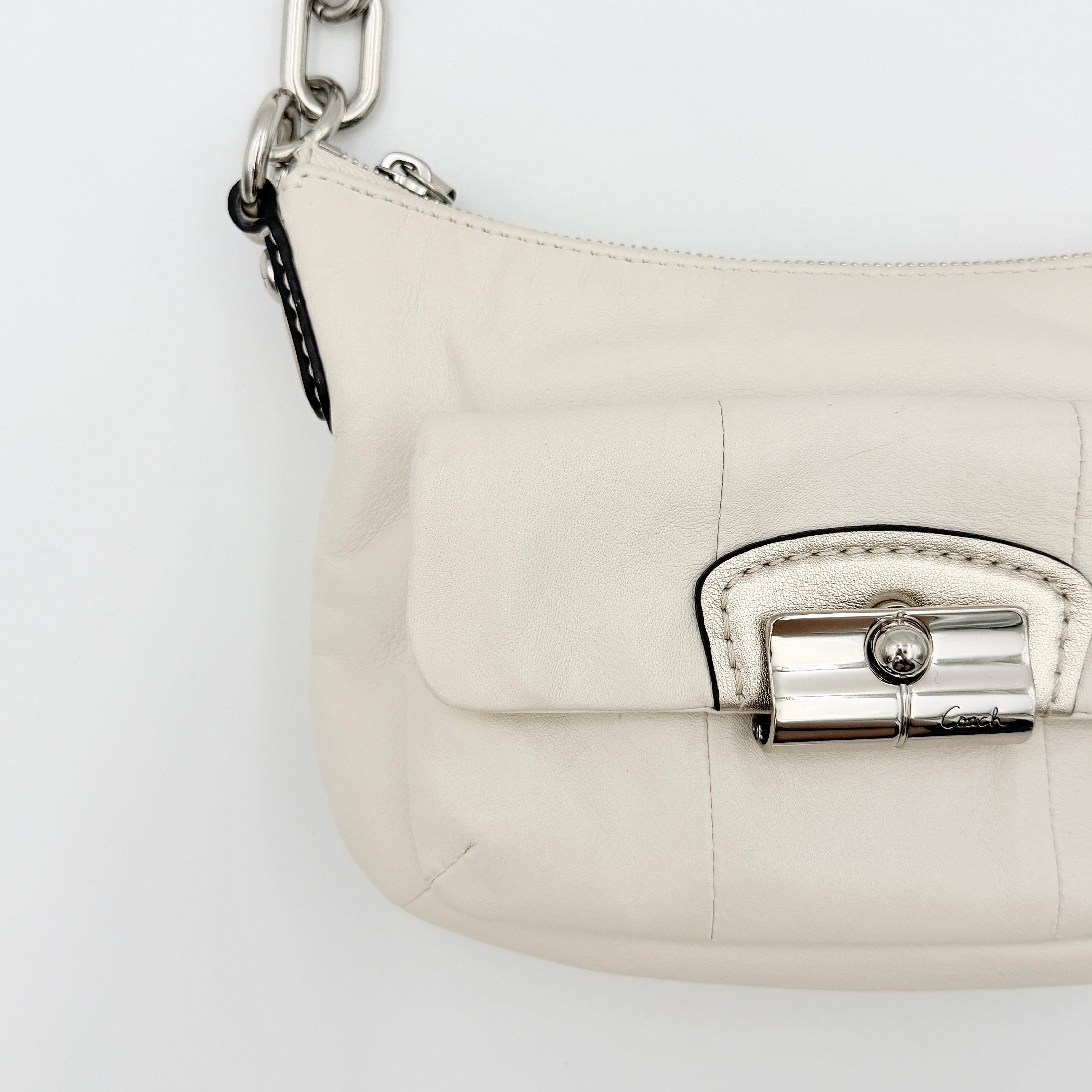 Coach Kristin Hobo Shoulder Bag in ivory leather with silver-tone hardware and a structured short strap.