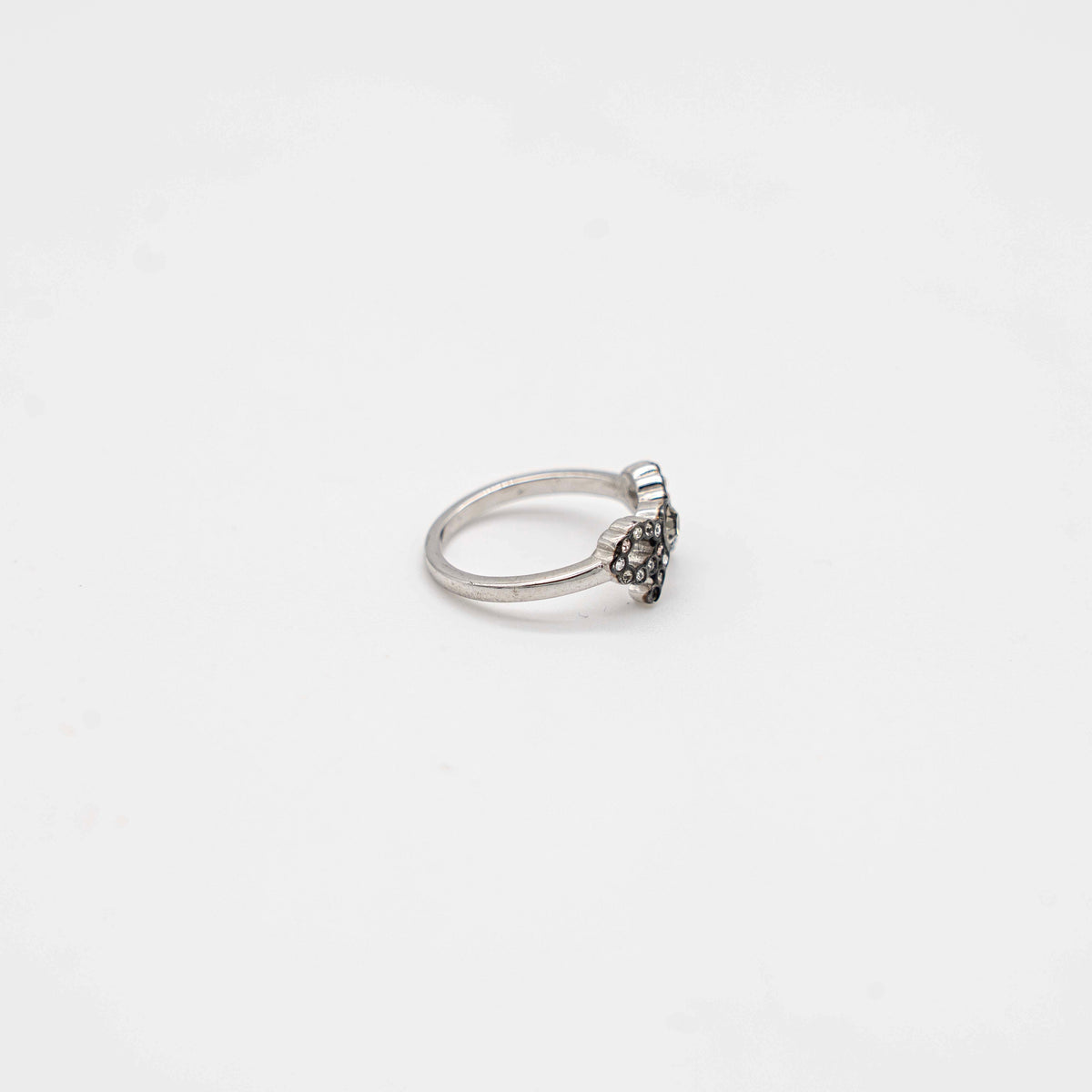 Coach silver ring with a rhinestone-encrusted bow motif, photographed against a white background.