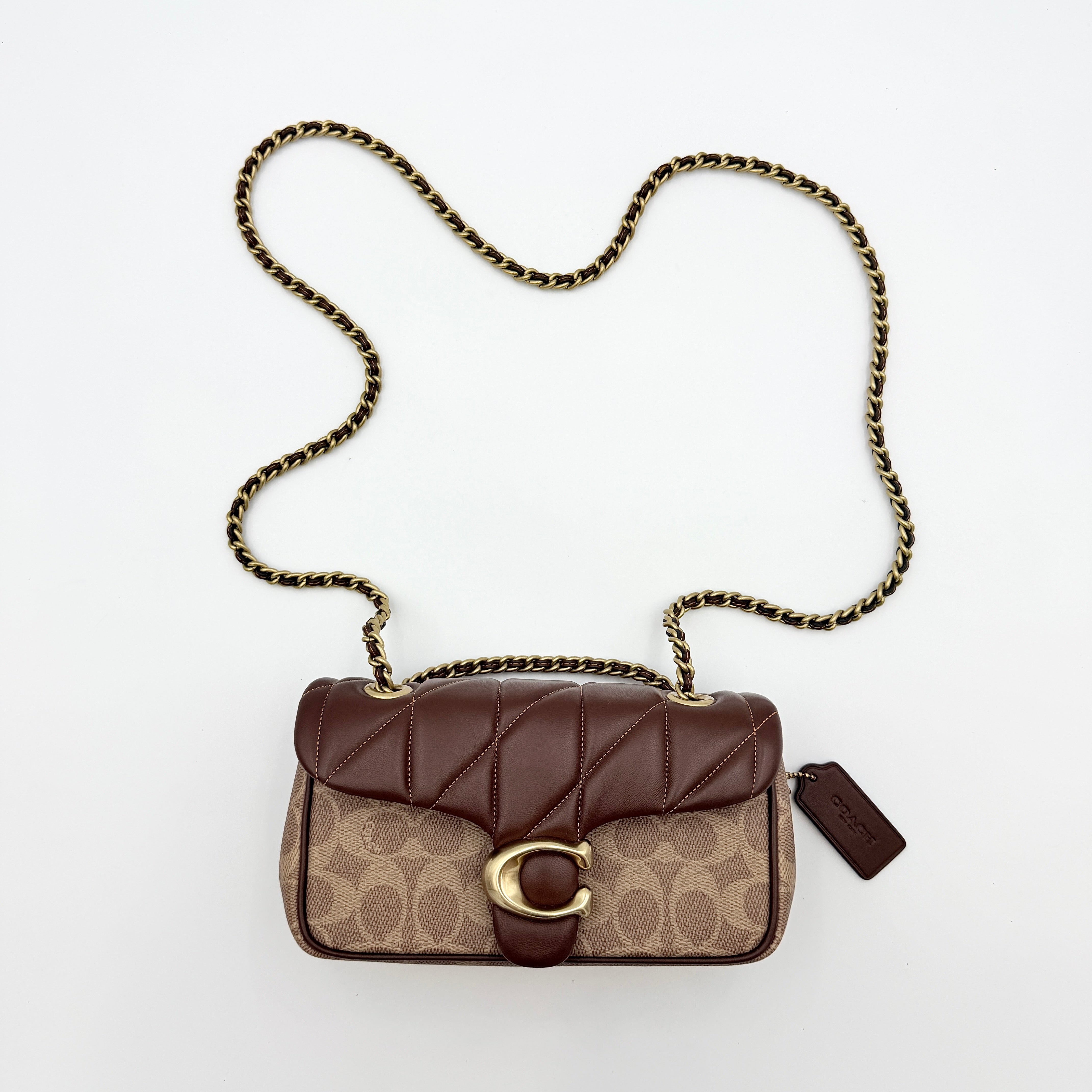 Coach Signature Quilted Tabby Shoulder Bag in brown monogram canvas with gold chain strap and oversized C clasp.