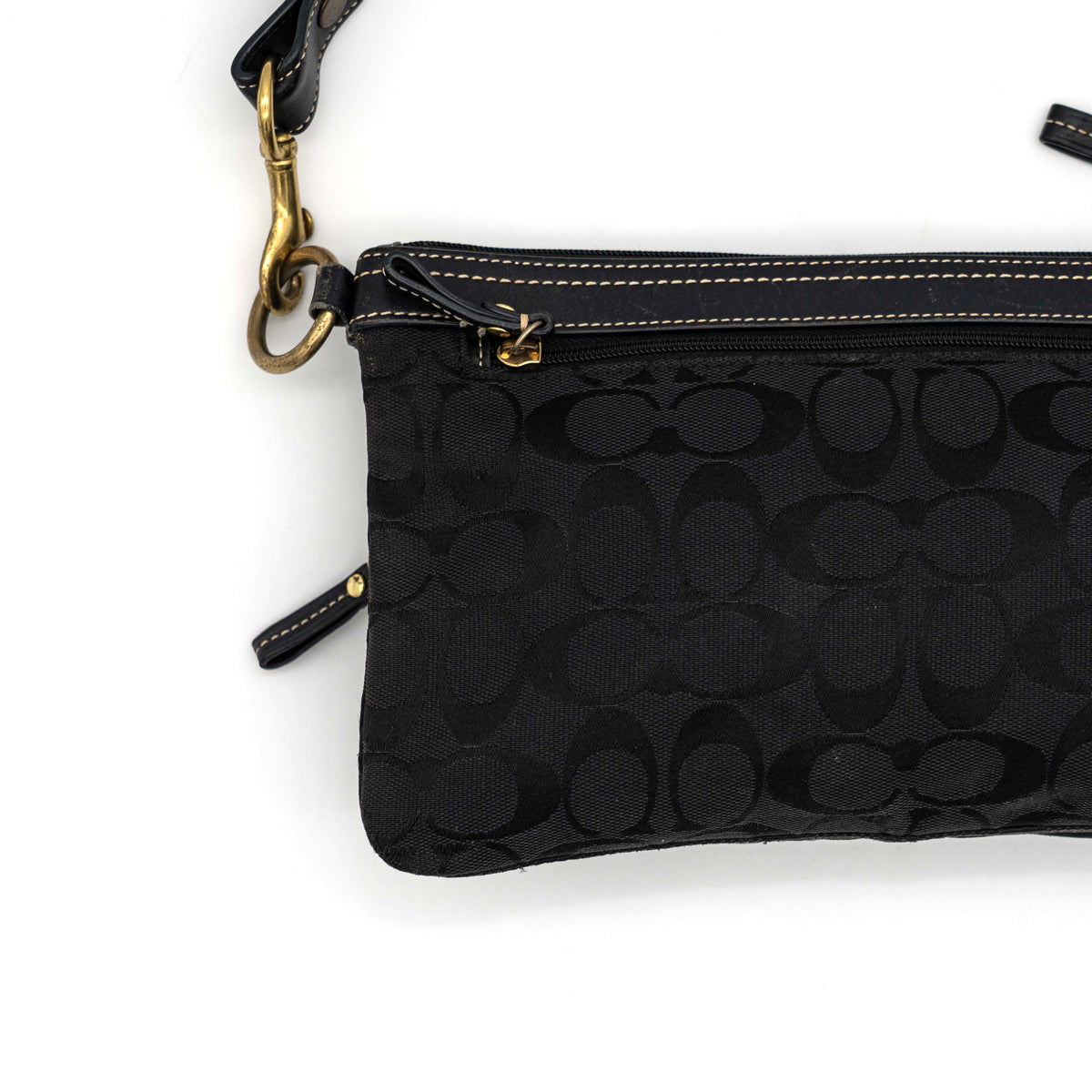 Coach Signature Double Pocket Shoulder Bag in black jacquard with dual zip pockets and an adjustable leather strap.