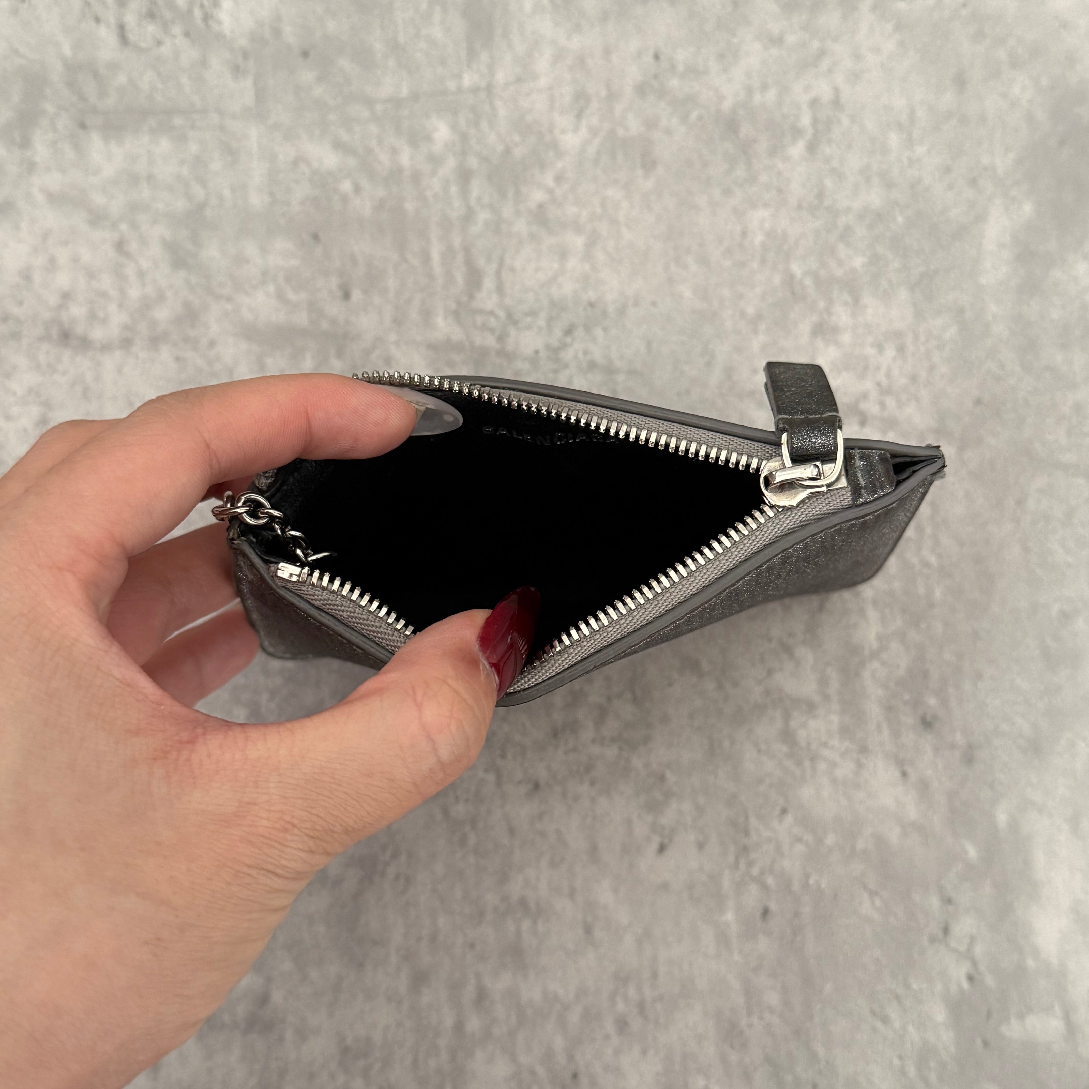 Balenciaga Graphic Print Silver Wallet, metallic silver leather with bold black logo and zip closure with keyring chain.