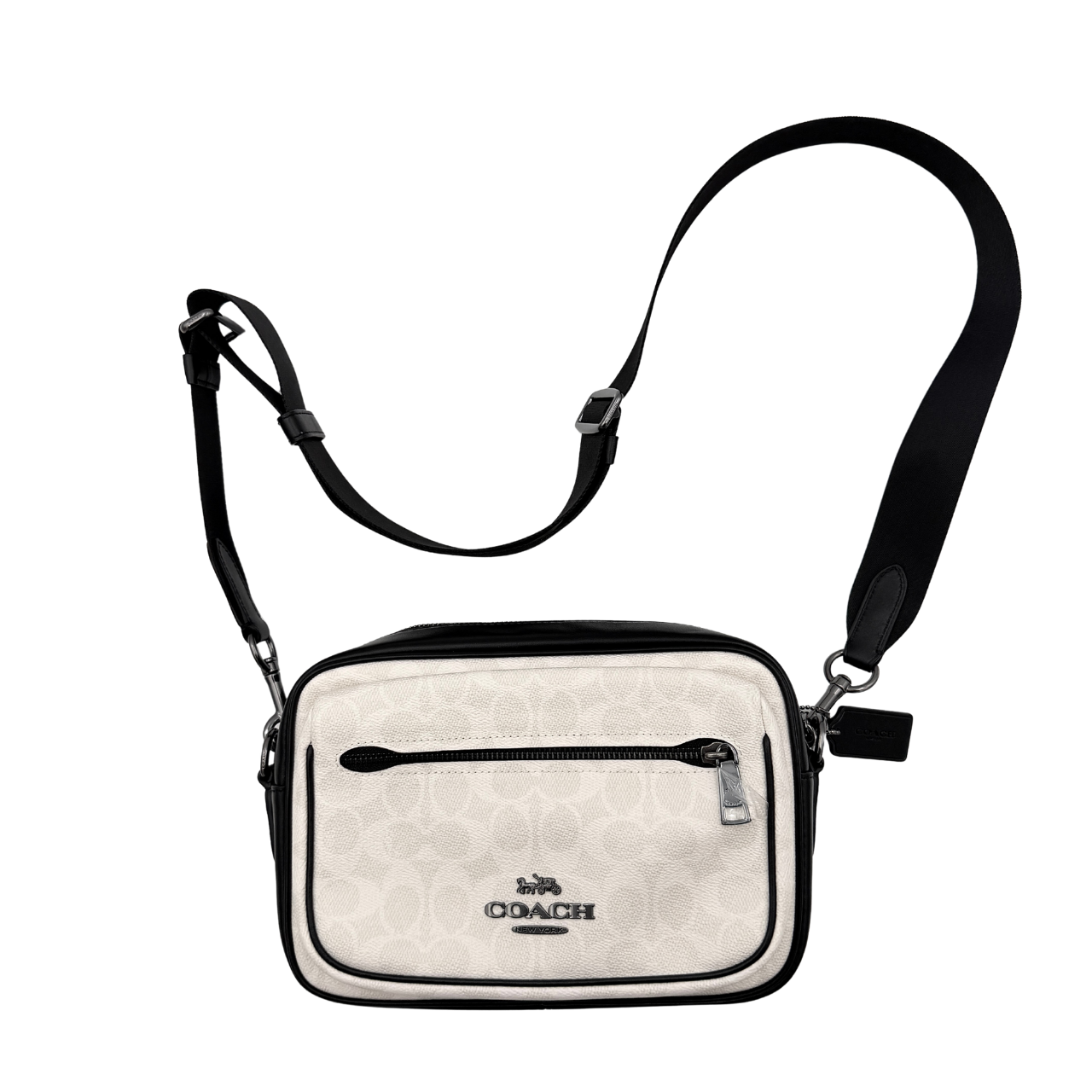Coach Signature Elias Crossbody Bag in white canvas with black leather trim and silver hardware, styled with an adjustable black strap.